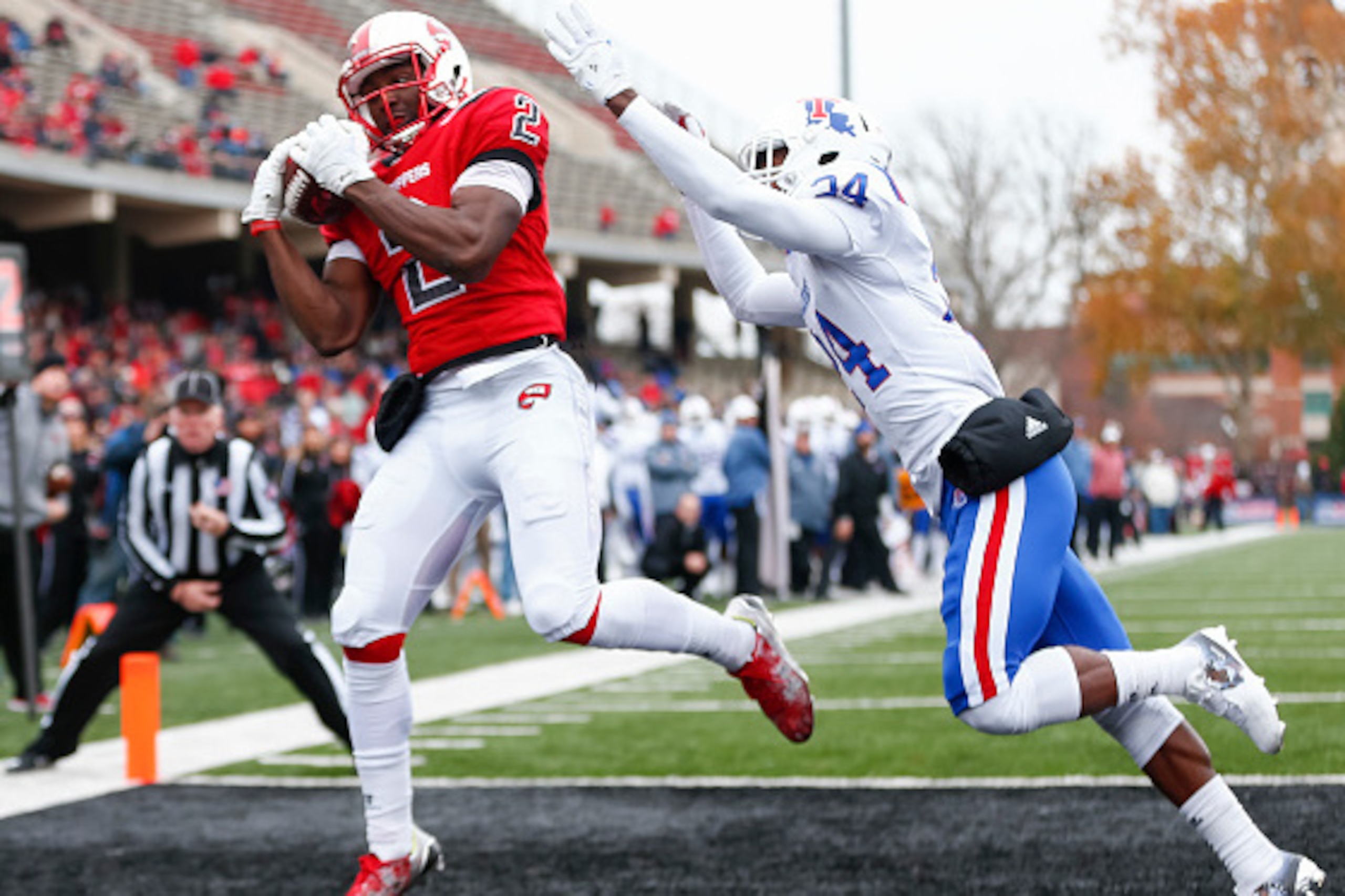 BOWLING GREEN, KY - DECEMBER 03: Taywan Taylor #2 of the Western Kentucky Hilltoppers catches the ball in the end zone for a touchdown as L'Jarius Sneed #24 of the Louisiana Tech Bulldogs defends at Houchens-Smith Stadium on December 3, 2016 in Champaign,