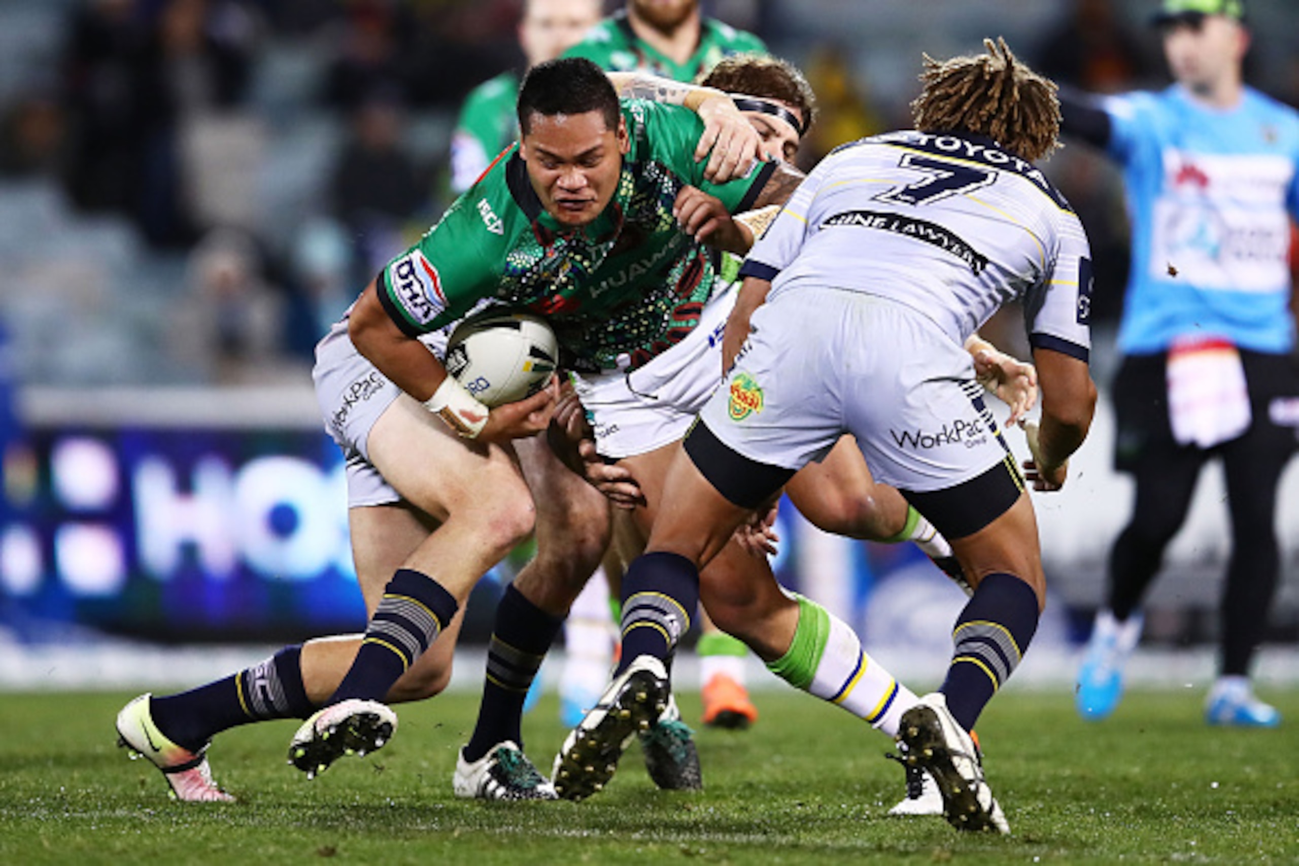 CANBERRA, AUSTRALIA - JULY 11: Joseph Leilua of the Raiders is tackled by the Cowboys defence during the round 18 NRL match between the Canberra Raiders and the North Queensland Cowboys at GIO Stadium on July 11, 2016 in Canberra, Australia.  (Photo by Br
