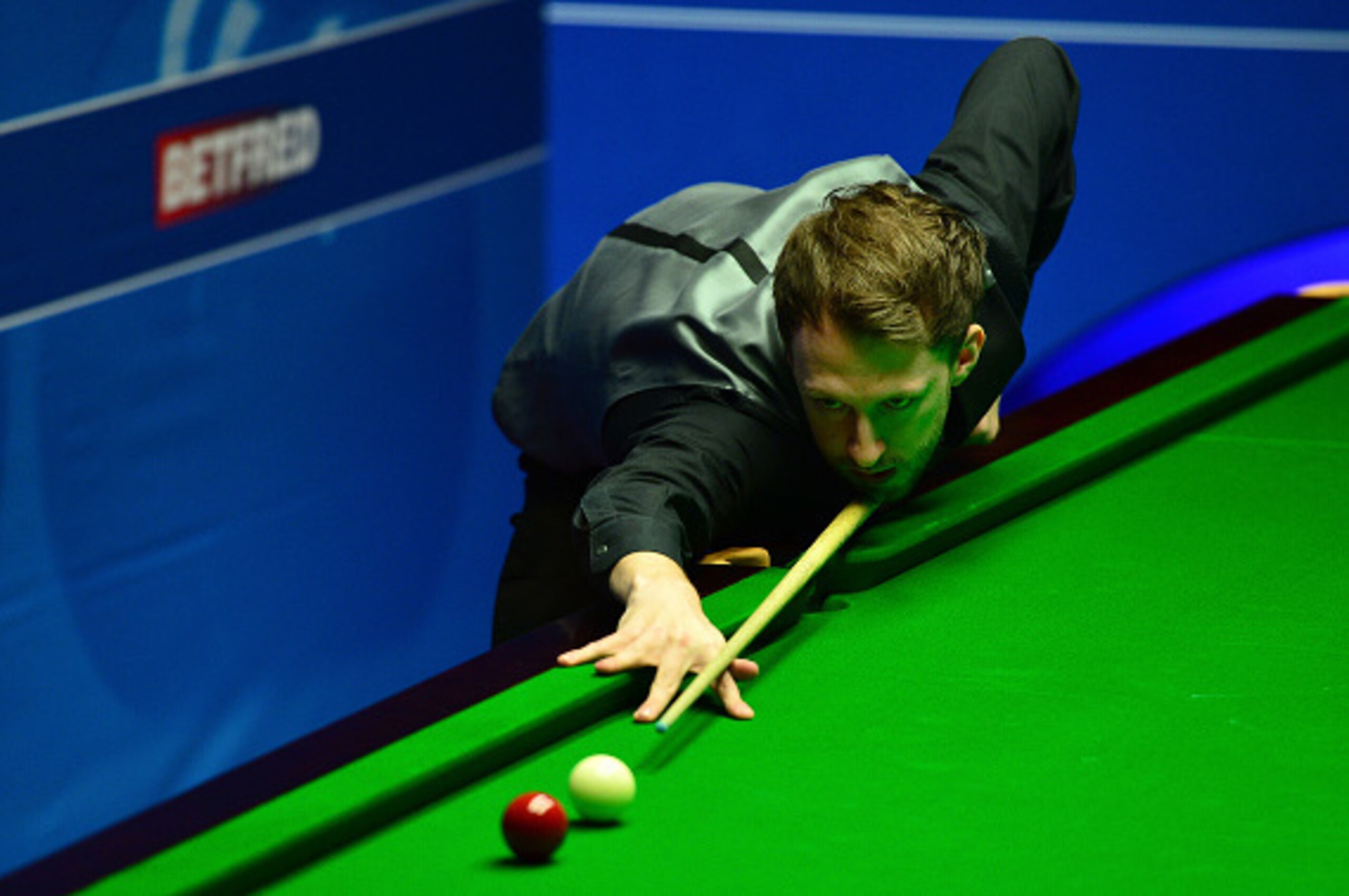 SHEFFIELD, ENGLAND - APRIL 21: Judd Trump of England plays a shot during his first round match against Liang Wenbo of China on day six of the World Snooker Championship at The Crucible Theatre on April 21, 2016 in Sheffield, England. (Photo by Dan Mulla SHEFFIELD, ENGLAND - APRIL 21: Judd Trump of England plays a shot during his first round match against Liang Wenbo of China on day six of the World Snooker Championship at The Crucible Theatre on April 21, 2016 in Sheffield, England. (Photo by Dan Mulla