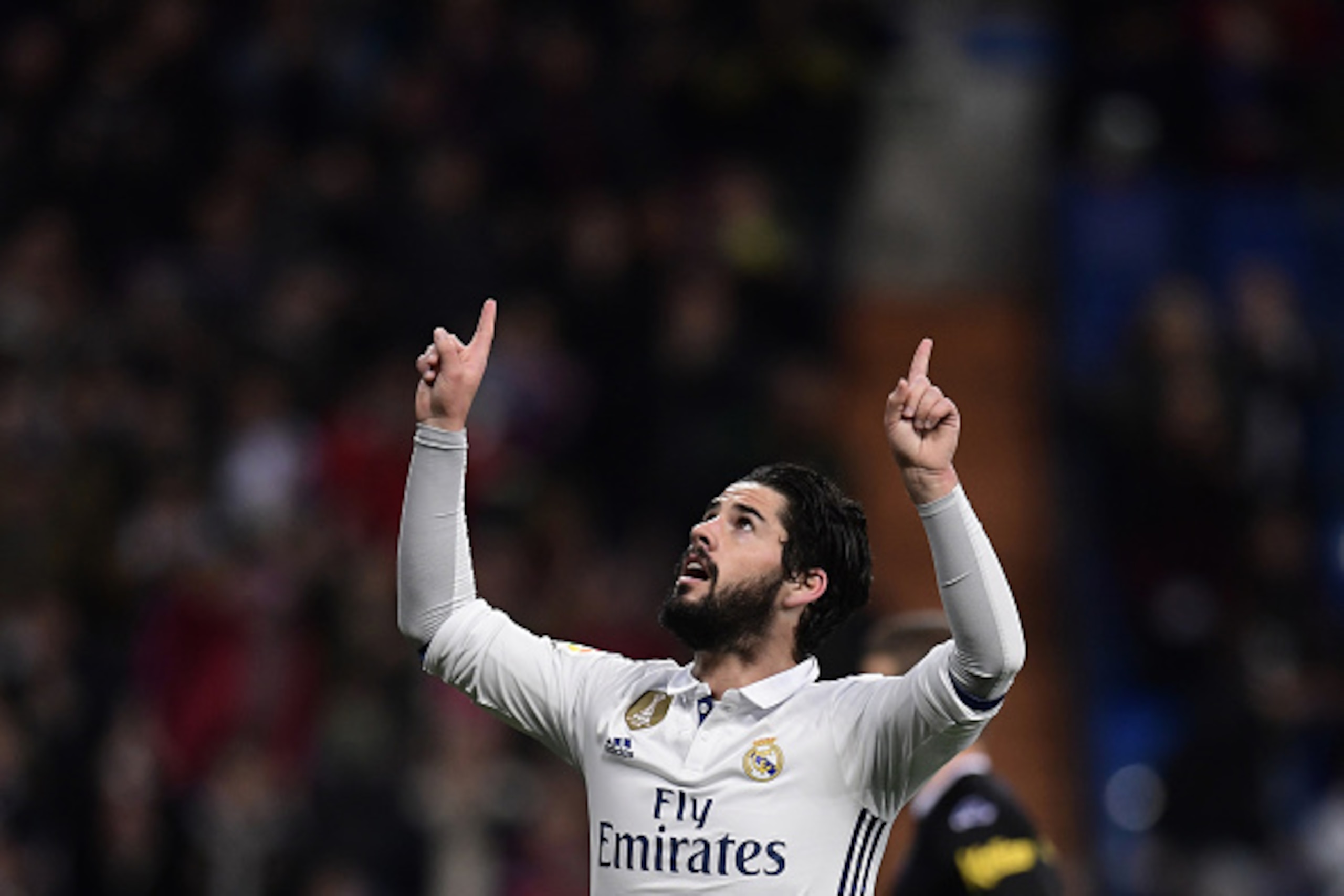 Real Madrid's midfielder Isco celebrates after scoring during the Spanish league football match Real Madrid CF vs UD Las Palmas at the Santiago Bernabeu stadium in Madrid on March 1, 2017. / AFP PHOTO / JAVIER SORIANO        (Photo credit should read JAVI