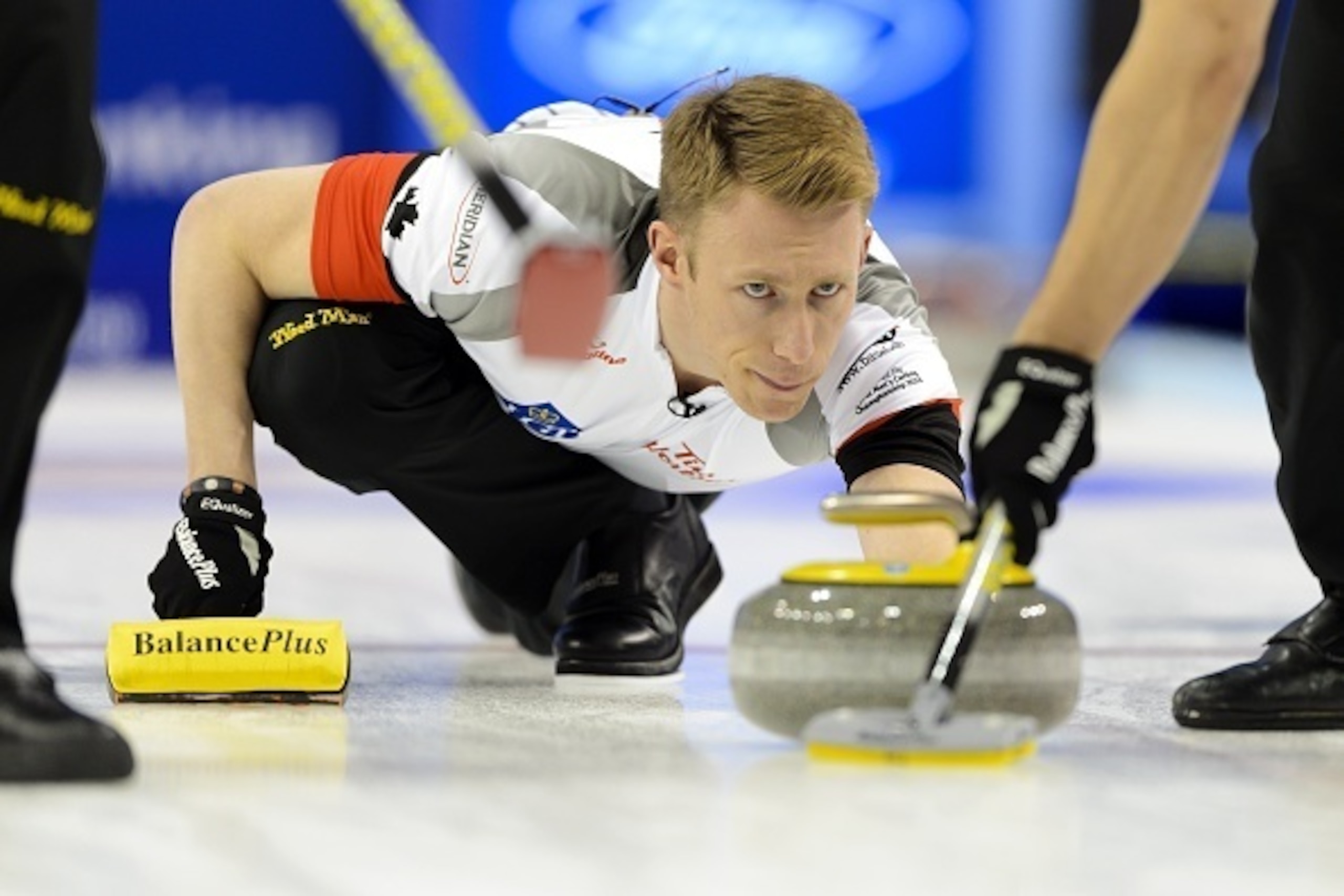 Canada's third Marc Kennedy delivers a stone during the gold medal game Canada vs Denmark at the World Men's Curling Championships on April 10, 2016 in Basel. / AFP / FABRICE COFFRINI        (Photo credit should read FABRICE COFFRINI/AFP/Getty Images)