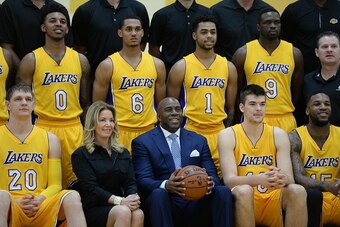 EL SEGUNDO, CA - FEBRUARY 27:  Magic Johnson and Jeannie Buss of the Los Angeles Lakers pose during the 2016-2017 Los Angeles Lakers team photo onFebruary 27, 2017 at the The Toyota Sports Center in El Segundo, California. NOTE TO USER: User expressly ack