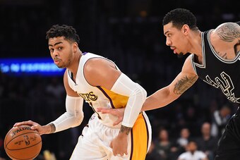 LOS ANGELES, CA - FEBRUARY 26:   Danny Green #14 of the San Antonio Spurs guards D'Angelo Russell #1 of the Los Angeles Lakers during the game at Staples Center on February 26, 2017 in Los Angeles, California.  NOTE TO USER: User expressly acknowledges an