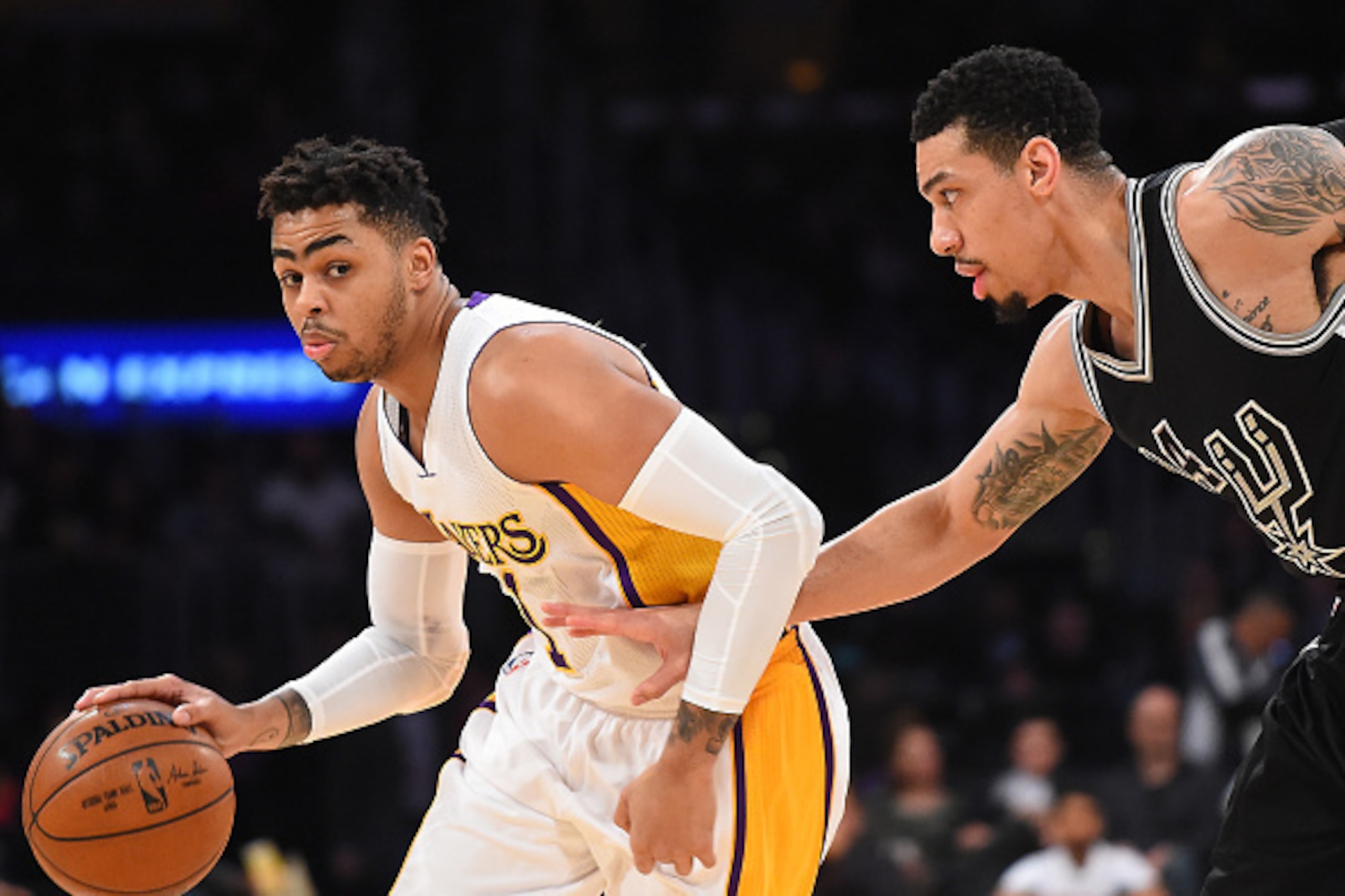 LOS ANGELES, CA - FEBRUARY 26:   Danny Green #14 of the San Antonio Spurs guards D'Angelo Russell #1 of the Los Angeles Lakers during the game at Staples Center on February 26, 2017 in Los Angeles, California.  NOTE TO USER: User expressly acknowledges an
