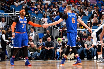 ORLANDO, FL - MARCH 1:  Carmelo Anthony #7 and Kristaps Porzingis #6 of the New York Knicks high-five during a game against the Orlando Magic on March 1, 2017 at Amway Center in Orlando, Florida. NOTE TO USER: User expressly acknowledges and agrees that, 