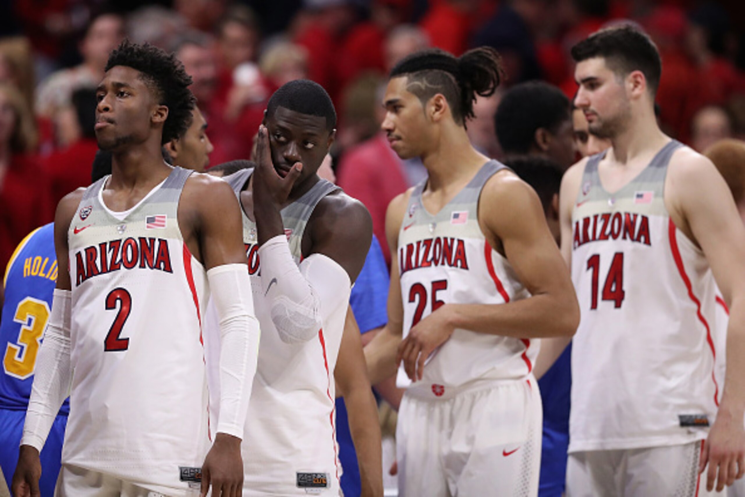 TUCSON, AZ - FEBRUARY 25:  (L-R) Kobi Simmons #2, Rawle Alkins #1, Keanu Pinder #25 and Dusan Ristic #14 of the Arizona Wildcats react after being defeated by the UCLA Bruins in the college basketball game at McKale Center on February 25, 2017 in Tucson, 