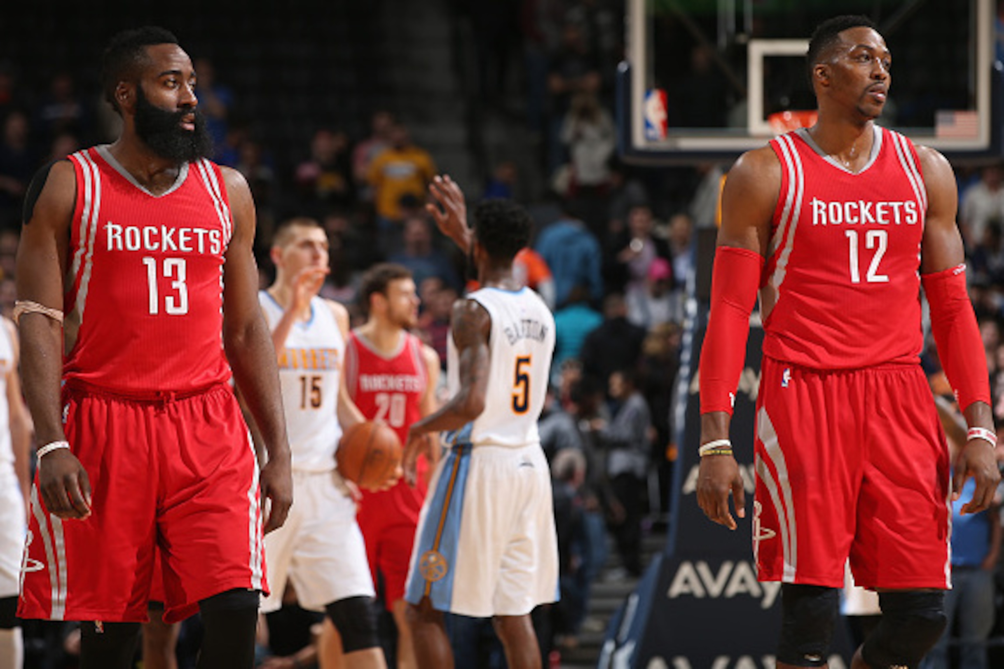 DENVER, CO - DECEMBER 14:  James Harden #13 and Dwight Howard #12 of the Houston Rockets walk down court as Will Barton #5 and Nikola Jokic #15 of the Denver Nuggets celebrate a play at Pepsi Center on December 14, 2015 in Denver, Colorado. The Nuggets de