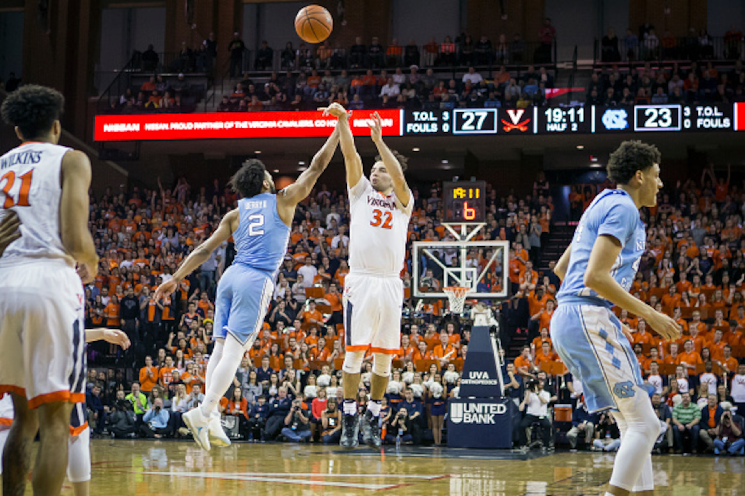 CHARLOTTESVILLE, VA - FEBRUARY 27: London Perrantes #32 of the Virginia Cavaliers shoots the ball over Joel Berry II #2 of the North Carolina Tar Heels during a game at John Paul Jones Arena on February 27, 2017 in Charlottesville, Virginia. (Photo by Che