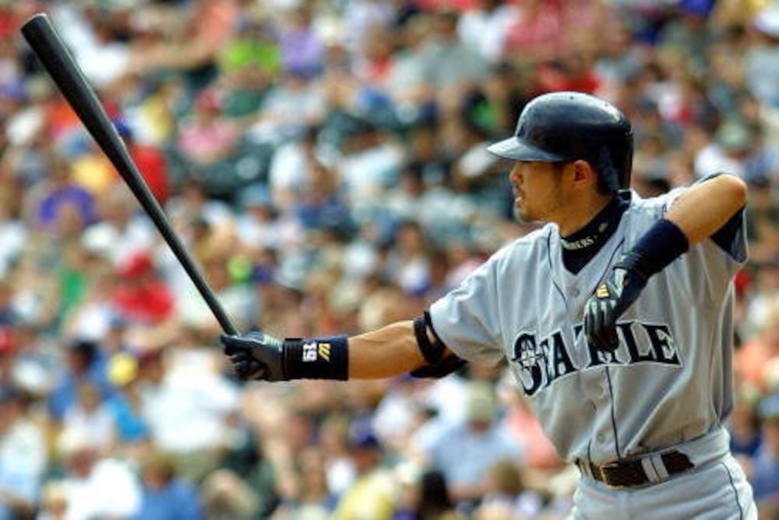 8 Apr 2001:  Seattle Mariners #51 Ichiro Suzuki sticks his bat out before taking a pitch against the Texas Rangers at the Ballpark in Arlington, Texas.  DIGITAL IMAGE Mandatory Credit: Ronald Martinez/ALLSPORT