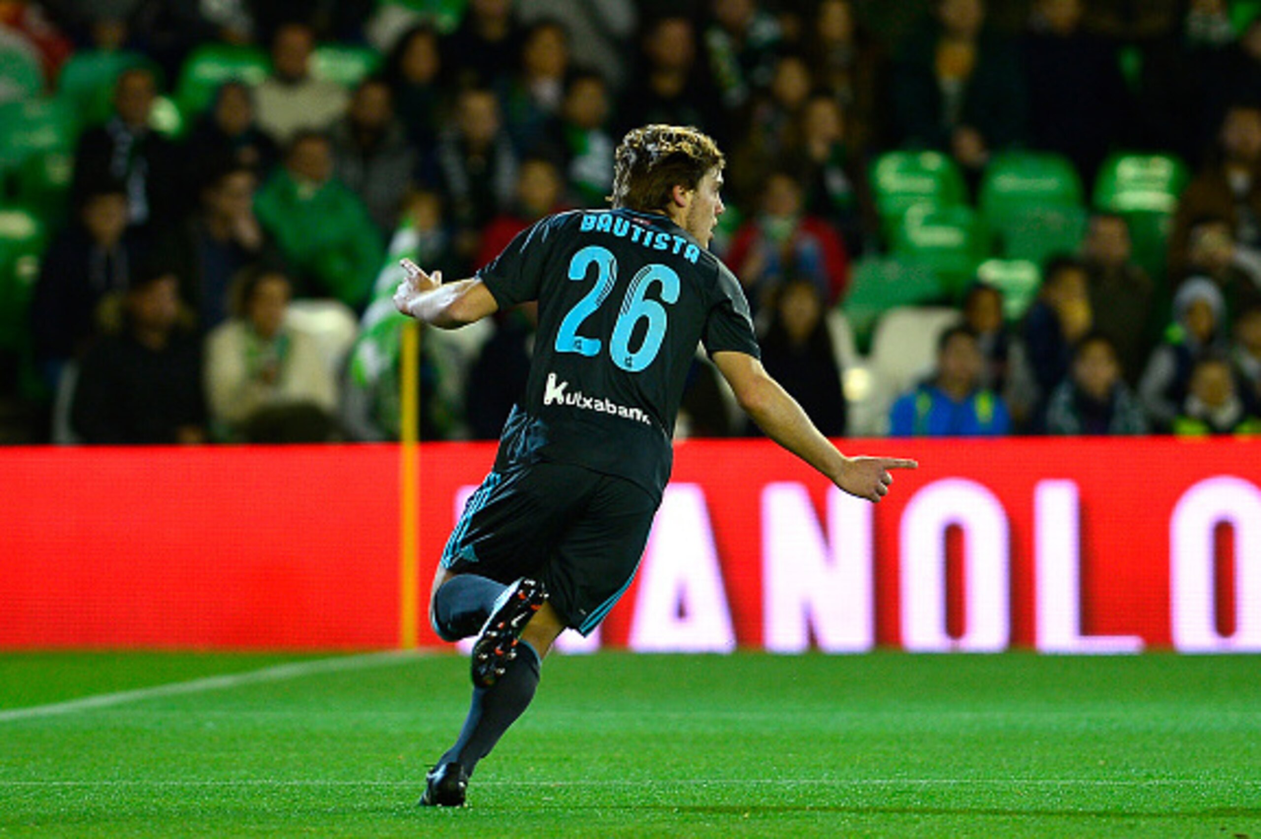 Real Sociedad's forward Jon Bautista (R) celebrates after scoring during the Spanish league football match Real Betis vs Real Sociedad at the Benito Villamarin stadium in Sevilla on march 3, 2017. / AFP PHOTO / CRISTINA QUICLER        (Photo credit should