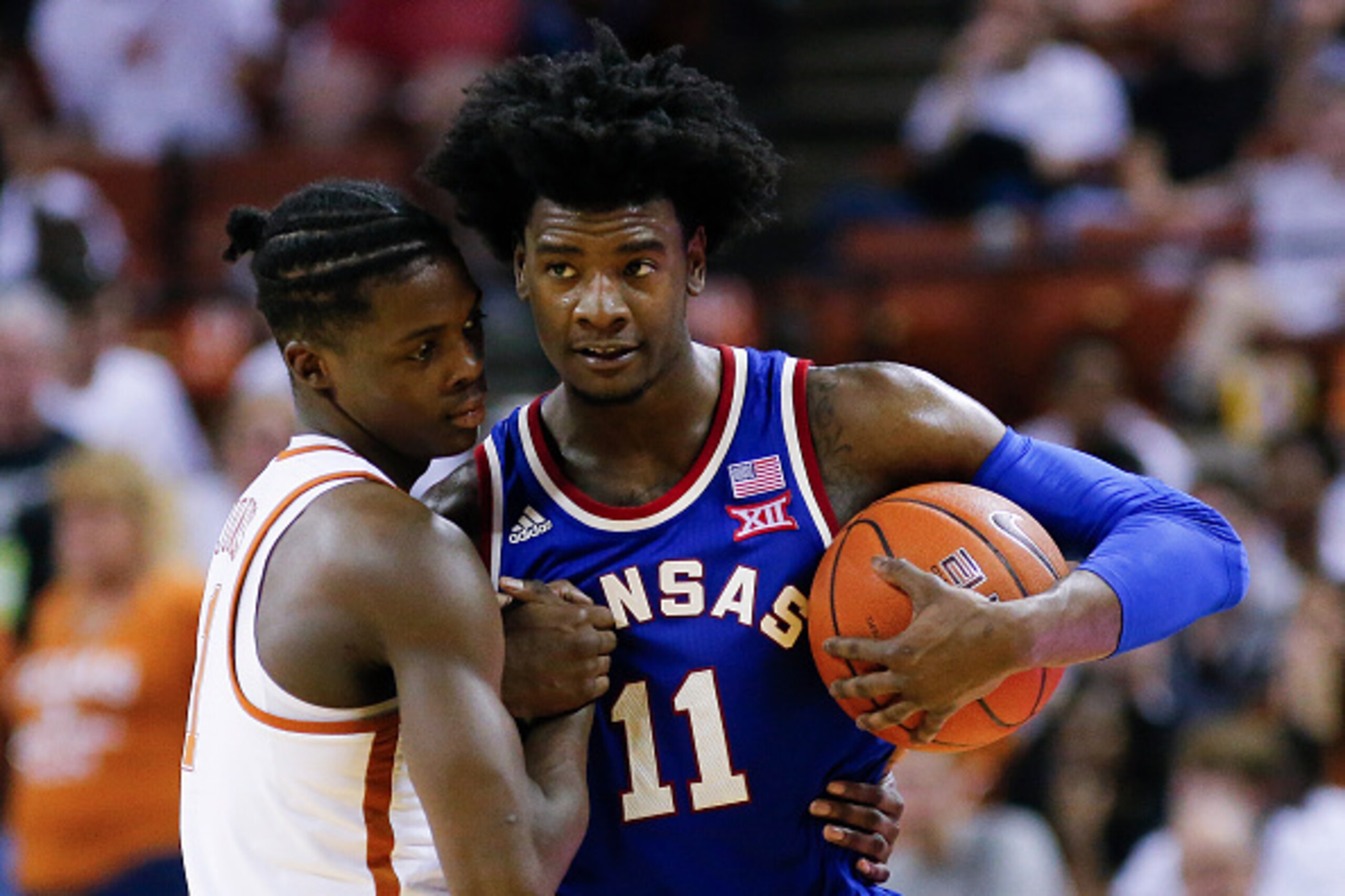 AUSTIN, TX - FEBRUARY 25: Josh Jackson #11 of the Kansas Jayhawks and Andrew Jones #1 of the Texas Longhorns meet at center court after the Kansas Jayhawks defeated the Texas Longhorns 76-66 at the Frank Erwin Center on February 25, 2017 in Austin, Texas.