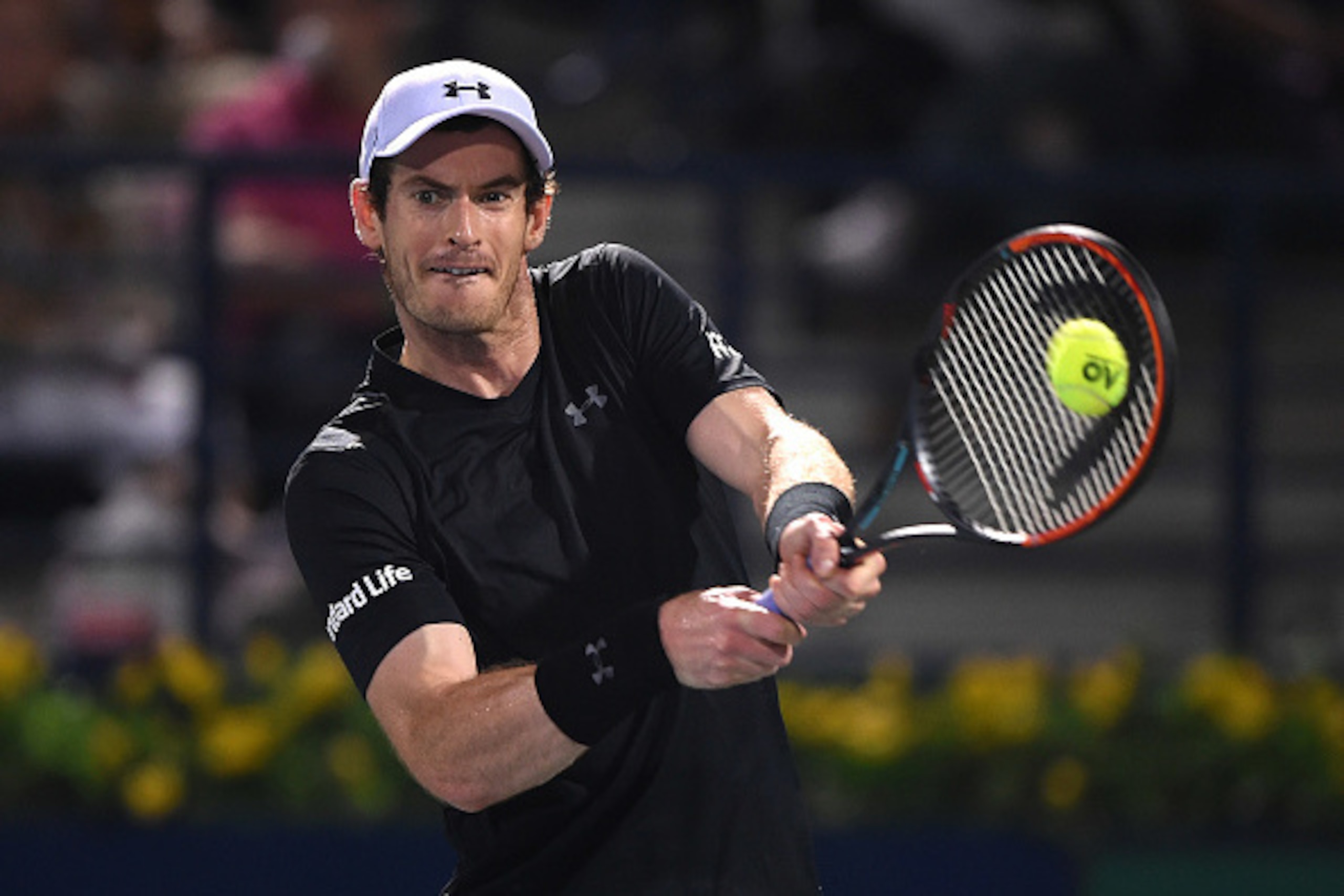 DUBAI, UNITED ARAB EMIRATES - MARCH 03:  Andy Murray of Great Britain plays a backhand during his semi final match against Lucas Pouille of France on day six of the ATP Dubai Duty Free Tennis Championship on March 3, 2017 in Dubai, United Arab Emirates.  