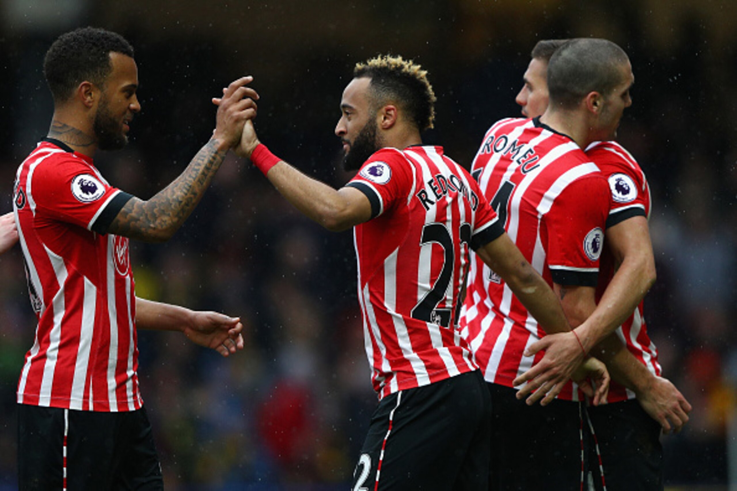 WATFORD, ENGLAND - MARCH 04:  Nathan Redmond of Southampton (C) celebrates scoring his sides third goal with Ryan Bertrand of Southampton (L) during the Premier League match between Watford and Southampton at Vicarage Road on March 4, 2017 in Watford, Eng
