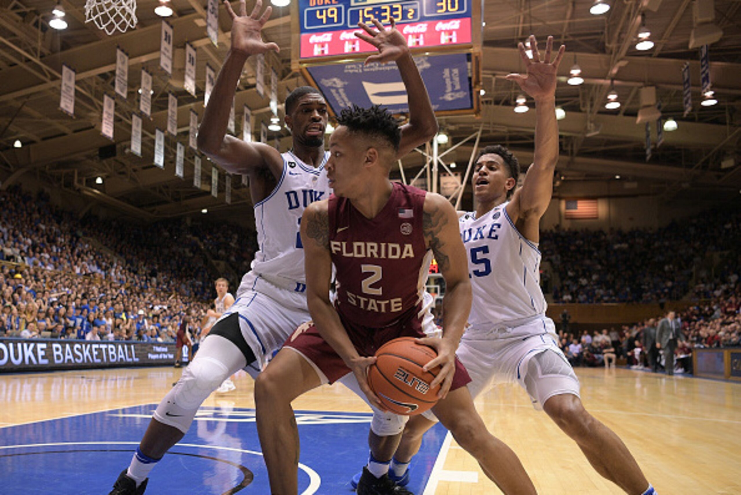 DURHAM, NC - FEBRUARY 28: Amile Jefferson #21 and Frank Jackson #15 of the Duke Blue Devils double-team CJ Walker #2 of the Florida State Seminoles at Cameron Indoor Stadium on February 28, 2017 in Durham, North Carolina. Duke won 75-70. (Photo by Lance K DURHAM, NC - FEBRUARY 28: Amile Jefferson #21 and Frank Jackson #15 of the Duke Blue Devils double-team CJ Walker #2 of the Florida State Seminoles at Cameron Indoor Stadium on February 28, 2017 in Durham, North Carolina. Duke won 75-70. (Photo by Lance K