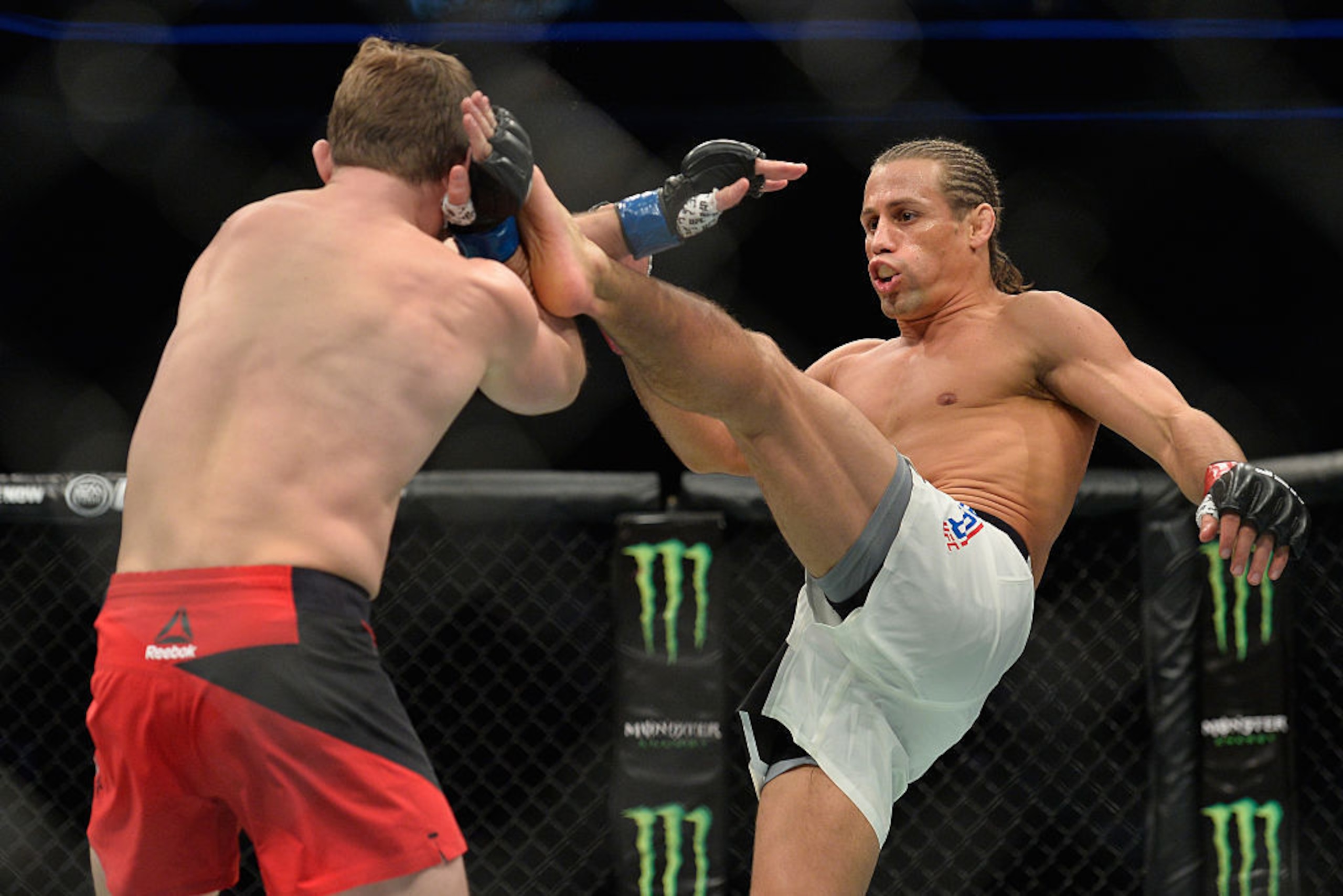 Urijah Faber kicks Brad Pickett in their bantamweight bout during the UFC Fight Night event inside the Golden 1 Center on December 17, 2016, in Sacramento, California. Urijah Faber kicks Brad Pickett in their bantamweight bout during the UFC Fight Night event inside the Golden 1 Center on December 17, 2016, in Sacramento, California.