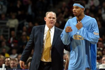 MILWAUKEE - JANUARY 28:  Head coach George Karl of the Denver Nuggets talks with Kenyon Martin #6 during a game against the Milwaukee Bucks at the Bradley Center on January 28, 2005 in Milwaukee, Wisconsin. The Nuggets defeated the Bucks 106-100.  NOTE TO