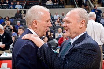 SAN ANTONIO, TX - MARCH 27: Head Coaches Gregg Popovich of the San Antonio Spurs, left, and George Karl of the Denver Nuggets greet before their game on March 27, 2013 at the AT&T Center in San Antonio, Texas. NOTE TO USER: User expressly acknowledges and