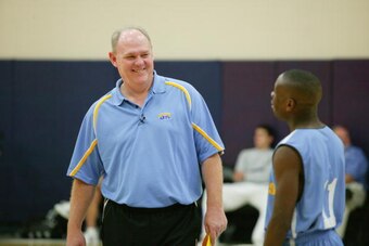 DENVER - OCTOBER 12: Head coach George Karl and Earl Boykins #11 of the Denver Nuggets talk before practice at the Pepsi Center on October 12, 2005 in Denver, Colorado.   NBA TV visited camp to shoot the team's practice for a 2005 Real Traning Camp segmen