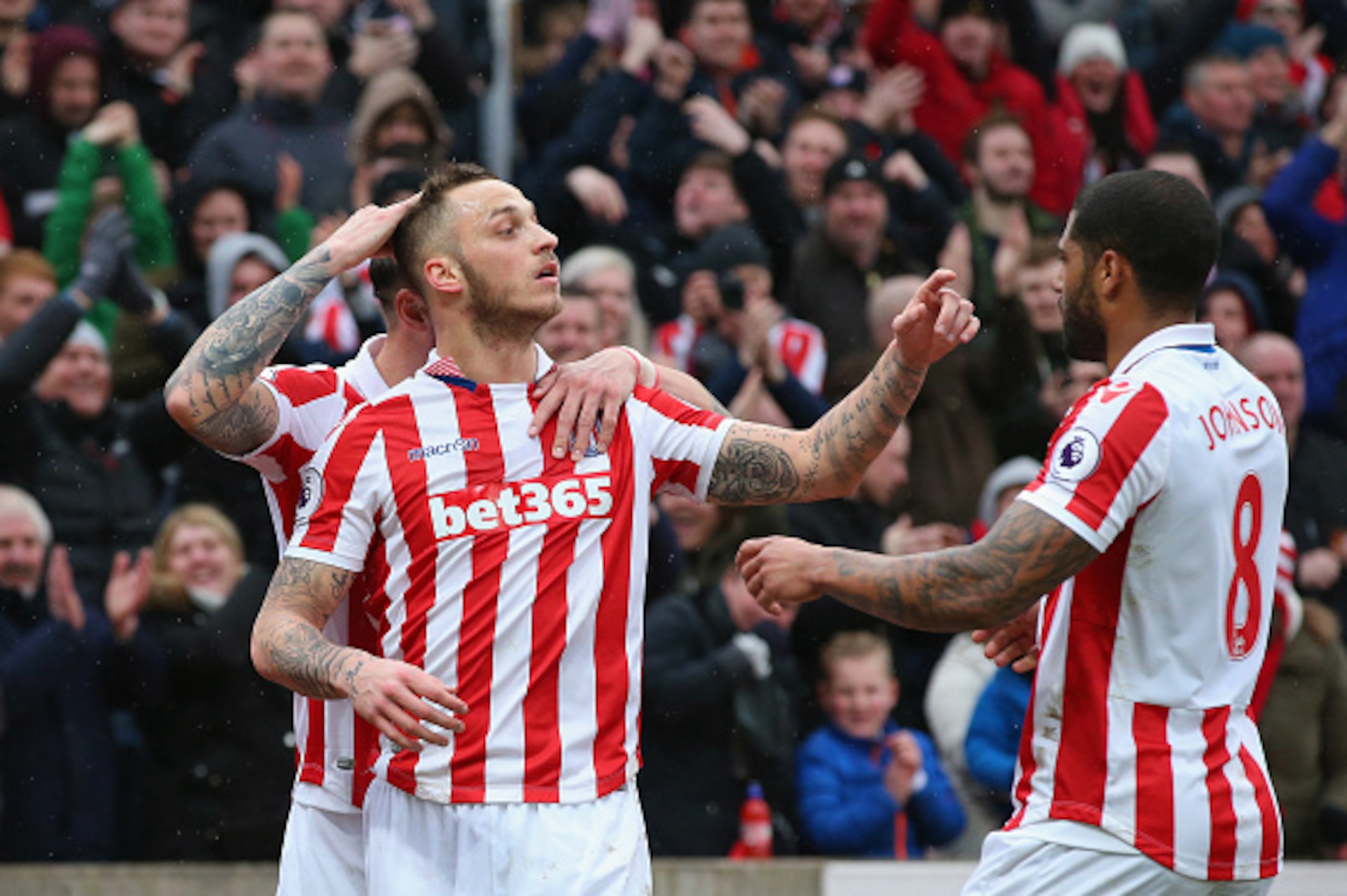 STOKE ON TRENT, ENGLAND - MARCH 04:  Marko Arnautovic of Stoke City (L) celebrates scoring his sides first goal with Glen Johnson of Stoke City (R) during the Premier League match between Stoke City and Middlesbrough at Bet365 Stadium on March 4, 2017 in 