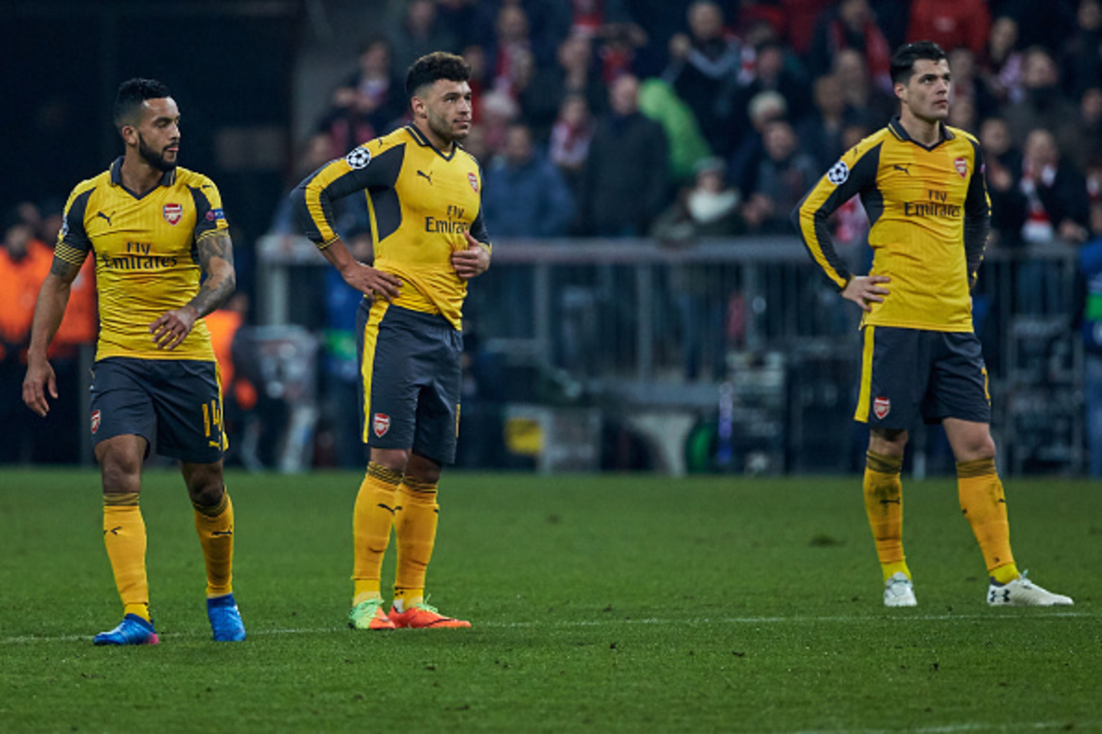 Munich, GERMANY - FEBRUARY 15: Theo Walcott of Arsenal , Alex Oxlade-Chamberlain of Arsenal and Granit Xhaka of Arsenal disappointed during the UEFA Champions League Round of 16 first leg match between FC Bayern Muenchen and Arsenal FC at Allianz Arena on