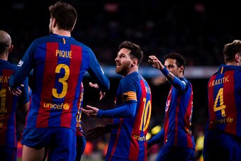 BARCELONA, SPAIN - MARCH 04: Lionel Messi (C) of FC Barcelona celebrates after his teammate Samuel Umtiti scored his team's fourth goal during the La Liga match between FC Barcelona and RC Celta de Vigo at Camp Nou stadium on March 4, 2017 in Barcelona, S