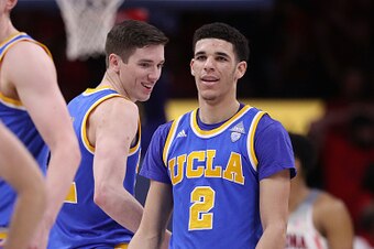 TUCSON, AZ - FEBRUARY 25:  Lonzo Ball #2 of the UCLA Bruins celebrates alongside TJ Leaf #22 during the final moments of the second half of the college basketball game against the Arizona Wildcats at McKale Center on February 25, 2017 in Tucson, Arizona. 