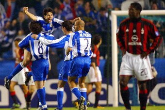 CORUNA, SPAIN:  Deportivo Coruna's players Sergio Gonzalez, Juan Valeron, Victor Sanchez and Manuel Pablo Garcia (L to R) celebrate after scoring 3rd goal against AC Milan during the European Champions League quarterfinal second leg match at Riazor Stadiu
