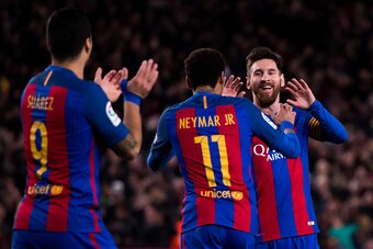 BARCELONA, SPAIN - MARCH 04: Lionel Messi (R) of FC Barcelona celebrates with his teammates Neymar Santos Jr (C) and Luis Suarez (L) after scoring his team's fifth goal during the La Liga match between FC Barcelona and RC Celta de Vigo at Camp Nou stadium
