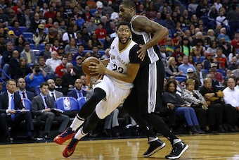 NEW ORLEANS, LA - MARCH 03:  Anthony Davis #23 of the New Orleans Pelicans drives against LaMarcus Aldridge #12 of the San Antonio Spurs during the second half of a game at the Smoothie King Center on March 3, 2017 in New Orleans, Louisiana. NOTE TO USER: