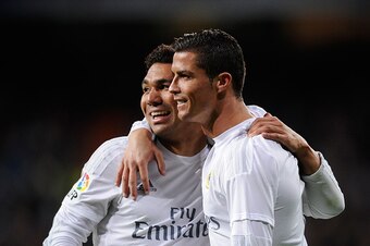 MADRID, SPAIN - MARCH 20:  Cristiano Ronaldo of Real Madrid celebrates with Henrique Casemiro after scoring Real's 2nd goal during the La Liga match between Real Madrid CF and Sevilla FC at Estadio Santiago Bernabeu on March 20, 2016 in Madrid, Spain.  (P
