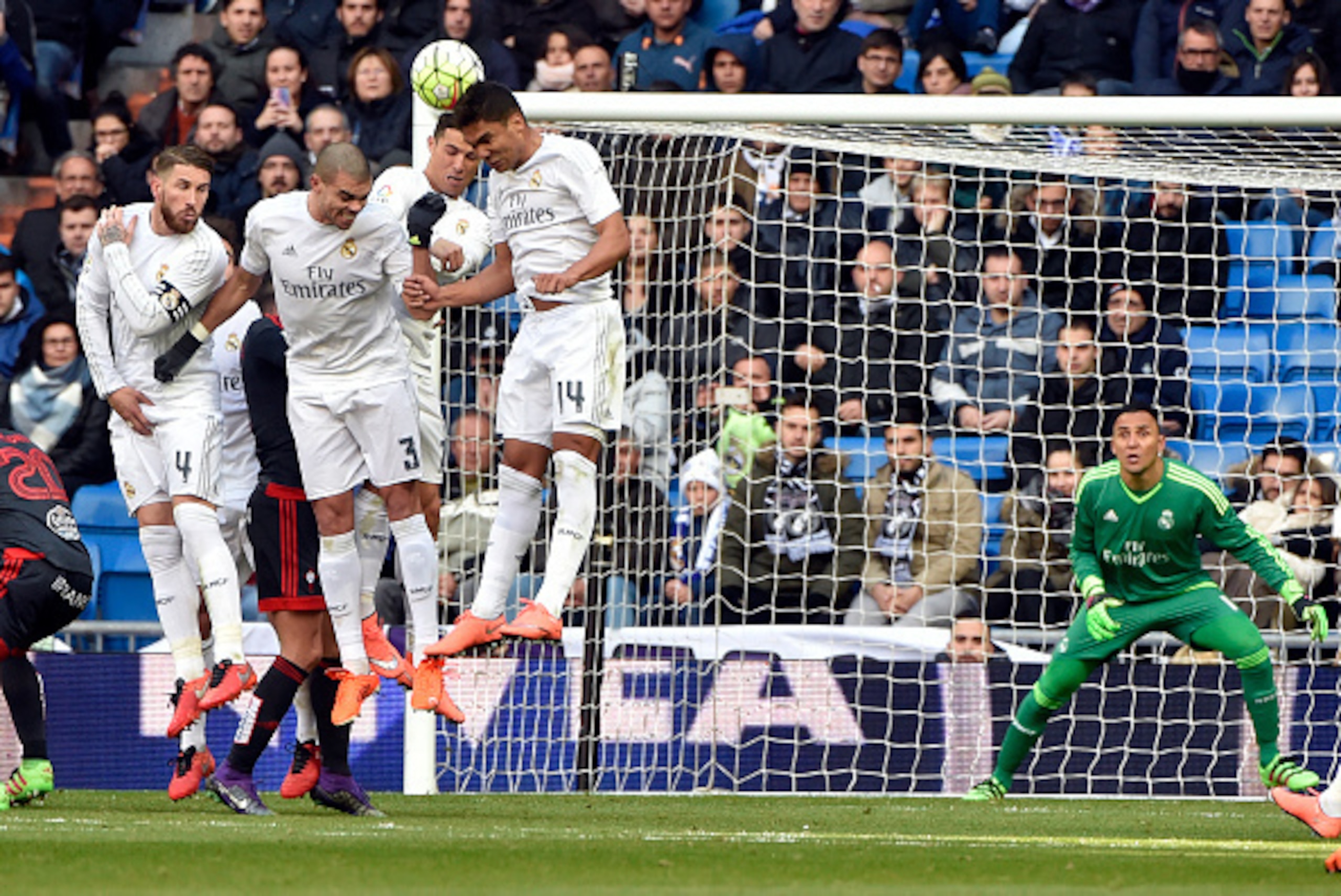 (L to R) Real Madrid's defender Sergio Ramos, Real Madrid's Portuguese defender Pepe, Real Madrid's Portuguese forward Cristiano Ronaldo and Real Madrid's Brazilian midfielder Casemiro jump as they form a defensive wall in front of Real Madrid's Costa Ric