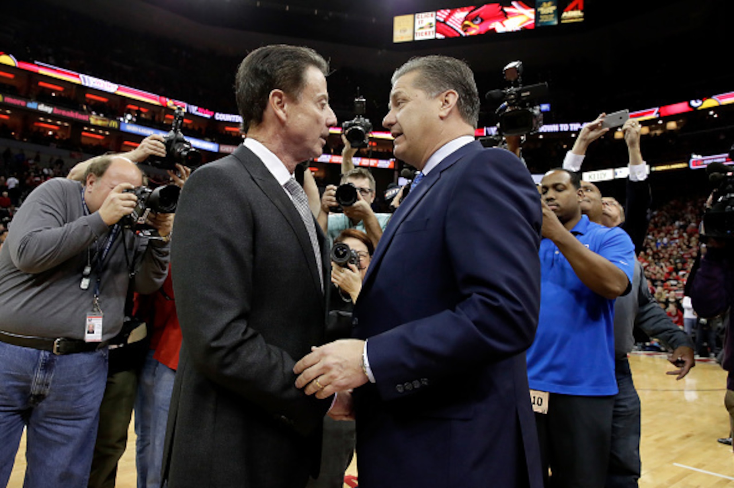 LOUISVILLE, KY - DECEMBER 21:  Rick Pitino the head coach of the Louisville Cardinals and John Calipari the head coach of the Kentucky Wildcats talk before the game at KFC YUM! Center on December 21, 2016 in Louisville, Kentucky.  (Photo by Andy Lyons/Get