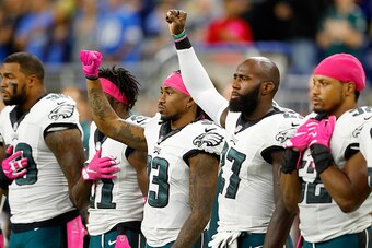 DETROIT, MI - OCTOBER 09: Ron Brooks #33 of the Philadelphia Eagles and Malcolm Jenkins #27 raise their fists during the National Anthem prior to the start of the game against the Detroit Lions at Ford Field on October 9, 2016 in Detroit, Michigan. (Photo