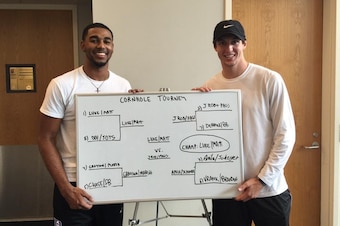 Duke's Matt Jones (left) and Luke Kennard show off a cornhole tournament bracket at head coach Mike Krzyzewski's house.