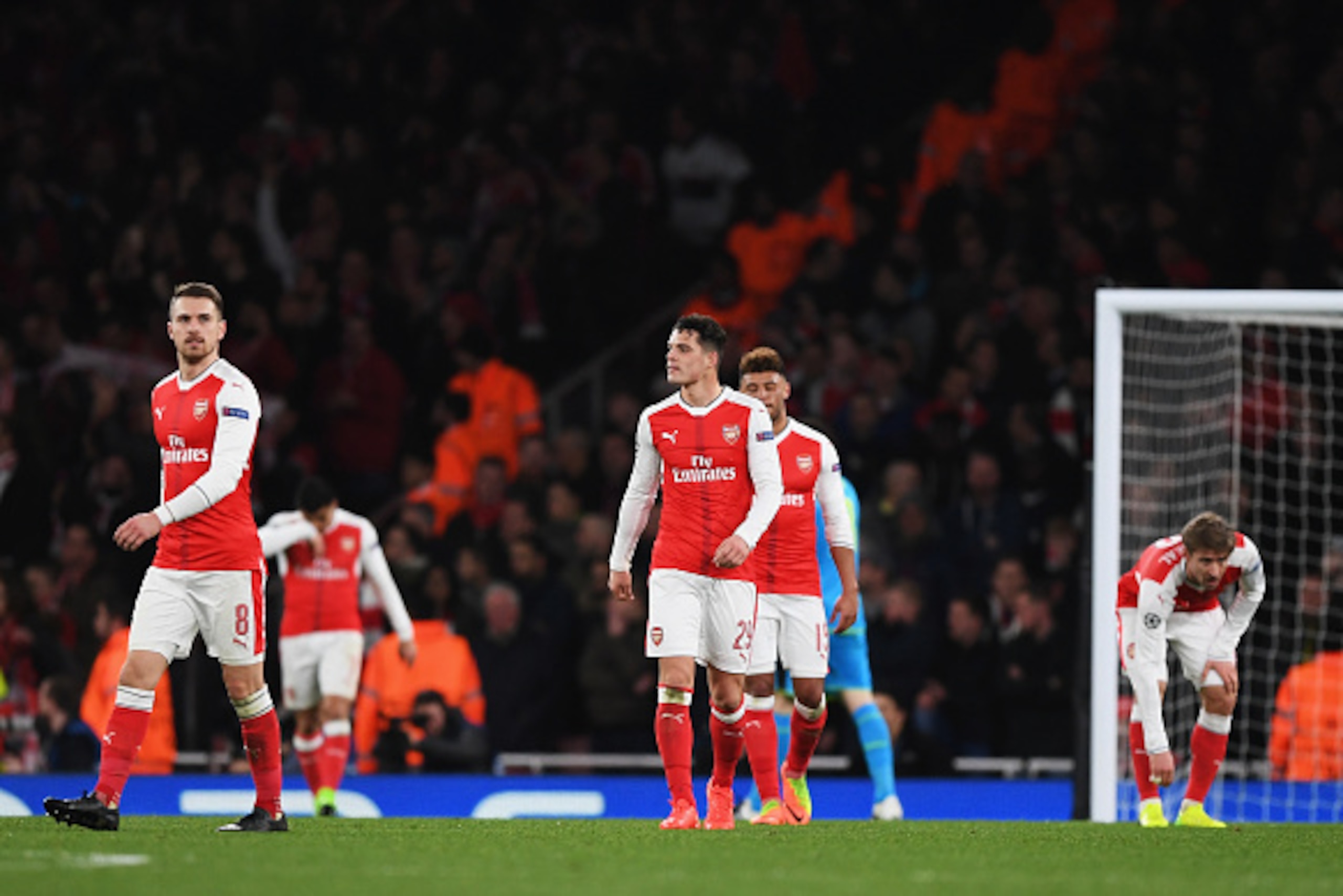 LONDON, ENGLAND - MARCH 07:  Aaron Ramsey (8) and Granit Xhaka of Arsenal (29) look dejected during the UEFA Champions League Round of 16 second leg match between Arsenal FC and FC Bayern Muenchen at Emirates Stadium on March 7, 2017 in London, United Kin
