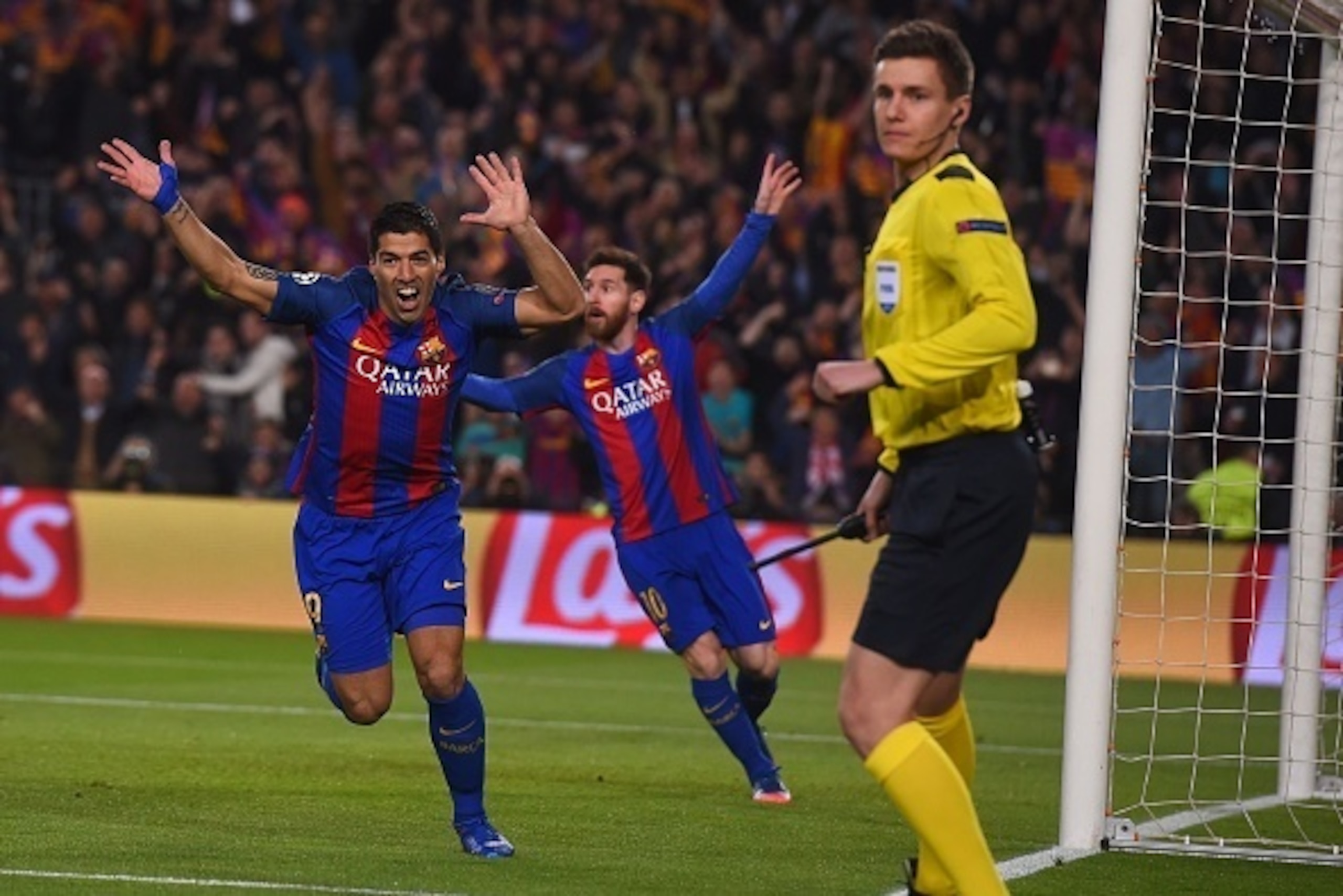 Barcelona's Uruguayan forward Luis Suarez (L) celebrates after scoring the opener during the UEFA Champions League round of 16 second leg football match FC Barcelona vs Paris Saint-Germain FC at the Camp Nou stadium in Barcelona on March 8, 2017. / AFP PH