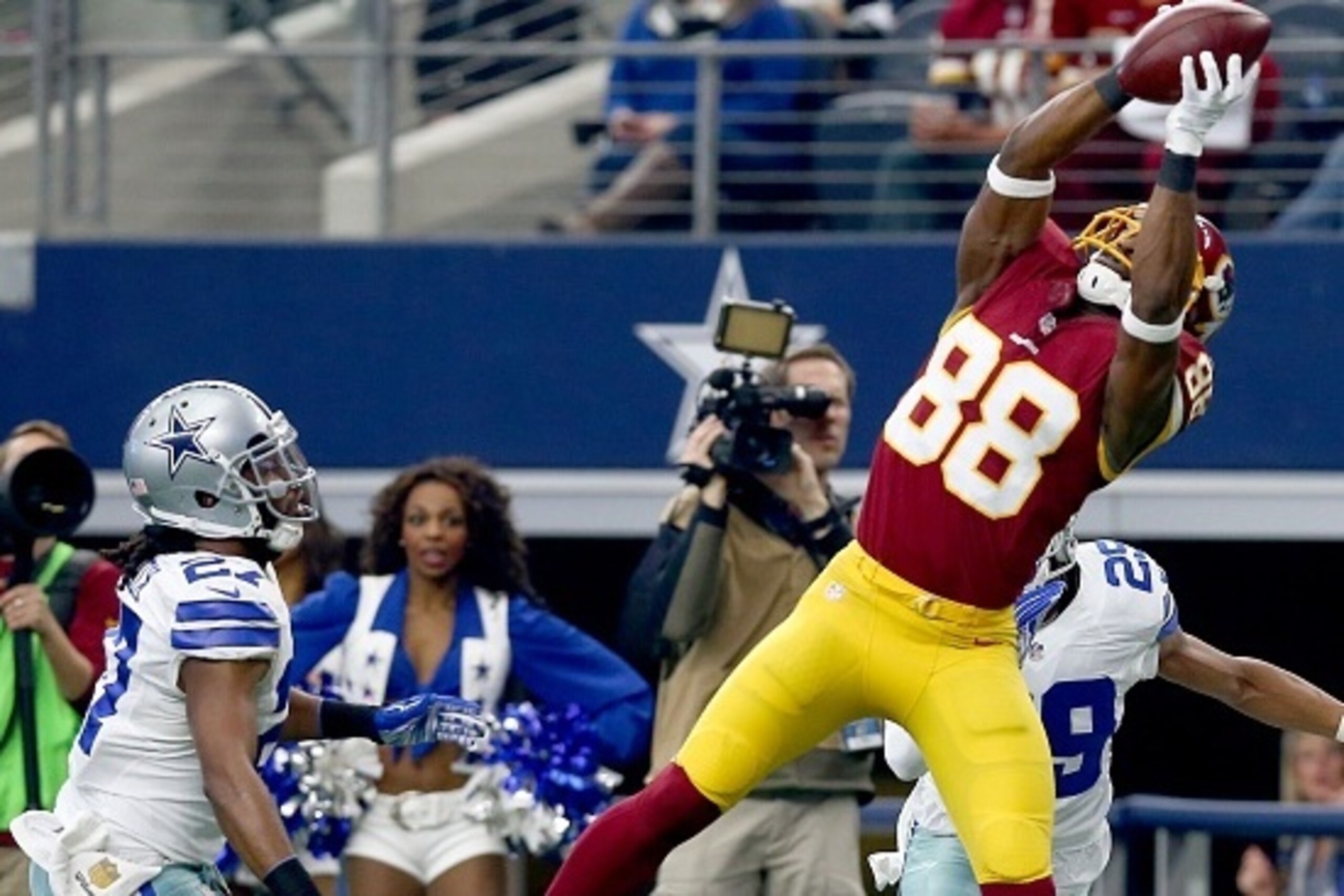 ARLINGTON, TX - JANUARY 03: Pierre Garcon #88 of the Washington Redskins catches a touchdown pass against J.J. Wilcox #27 of the Dallas Cowboys during the first  half at AT&T Stadium on January 3, 2016 in Arlington, Texas. (Photo by Tom Pennington/Getty I