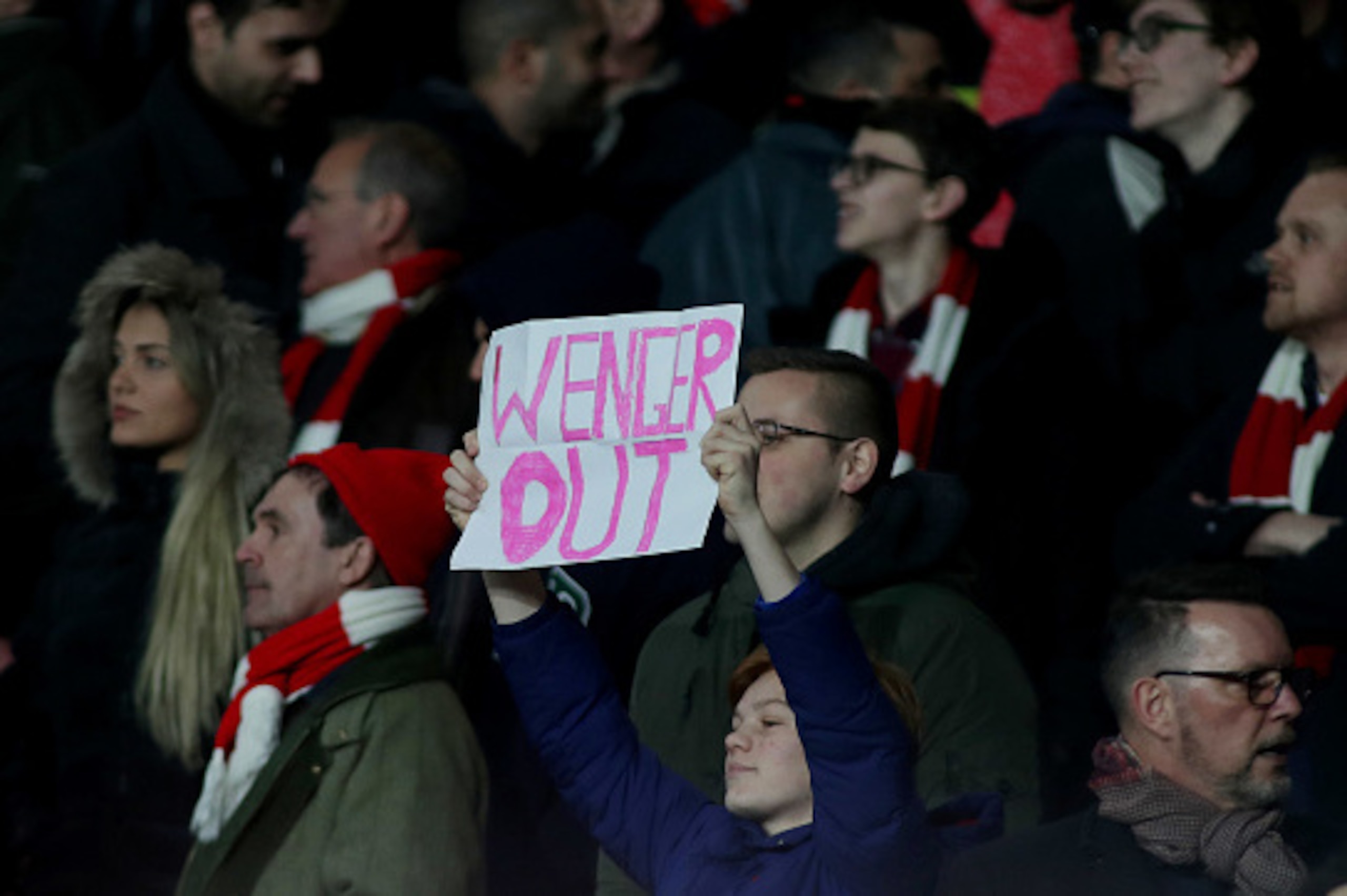 LONDON, ENGLAND - MARCH 07: A fan holds up a protest sign saying 'Wenger Out' during the UEFA Champions League Round of 16 second leg match between Arsenal FC and FC Bayern Muenchen at Emirates Stadium on March 7, 2017 in London, United Kingdom. (Photo by LONDON, ENGLAND - MARCH 07: A fan holds up a protest sign saying 'Wenger Out' during the UEFA Champions League Round of 16 second leg match between Arsenal FC and FC Bayern Muenchen at Emirates Stadium on March 7, 2017 in London, United Kingdom. (Photo by
