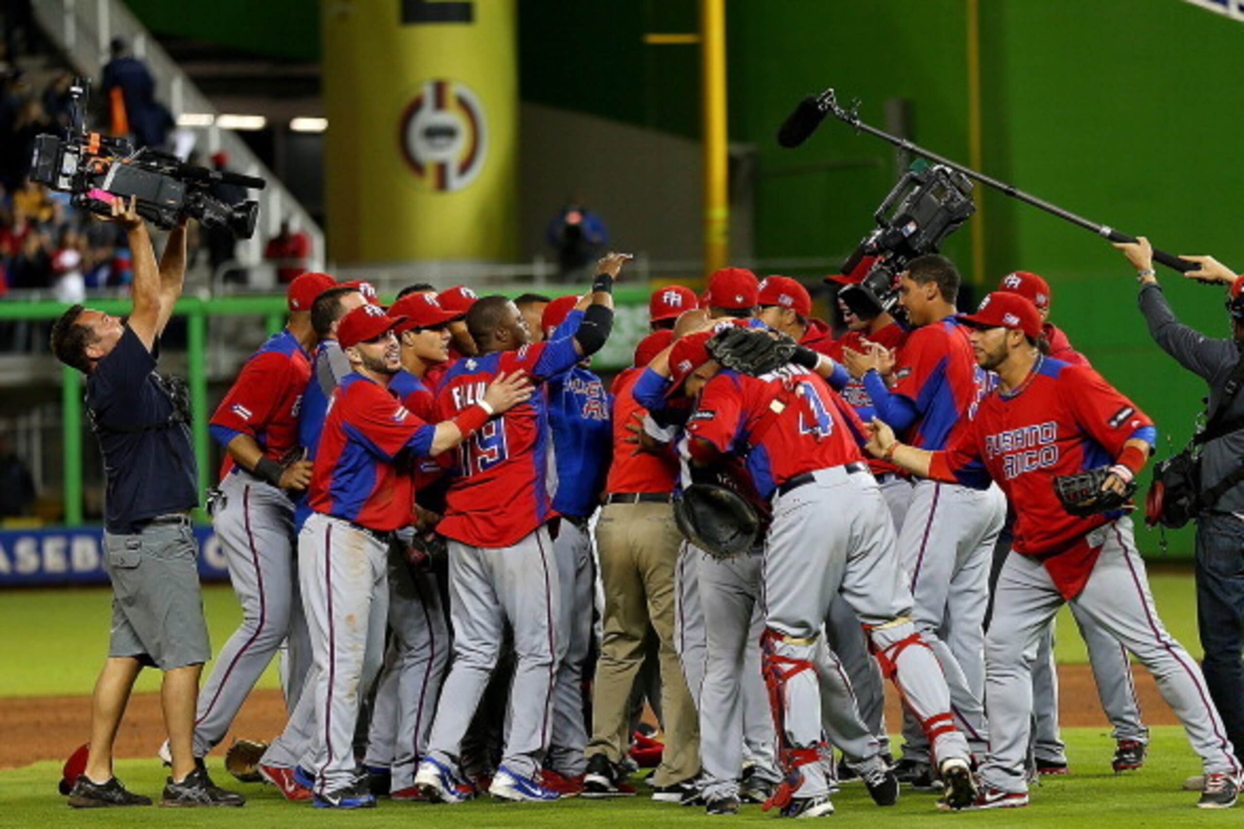 MIAMI, FL - MARCH 15:  Puerto Rico reacts to winning a World Baseball Classic second round game against the United States at Marlins Park on March 15, 2013 in Miami, Florida.  (Photo by Mike Ehrmann/Getty Images)
