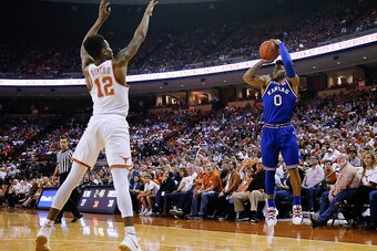 AUSTIN, TX - FEBRUARY 25: Frank Mason III #0 of the Kansas Jayhawks shoots over Kerwin Roach Jr. #12 of the Texas Longhorns at the Frank Erwin Center on February 25, 2017 in Austin, Texas. (Photo by Chris Covatta/Getty Images)