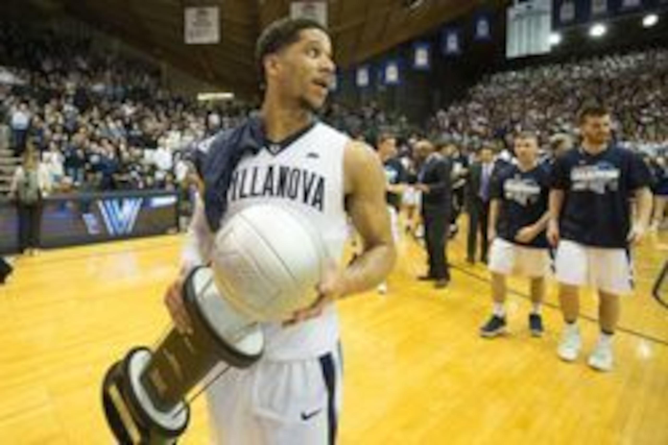 Feb 25, 2017; Villanova, PA, USA; Villanova Wildcats guard Josh Hart (3) carries the Big East regular season trophy onto the court after defeating the Creighton Bluejays at The Pavilion. The Villanova Wildcats won 79-63.Mandatory Credit: Bill Streicher-US