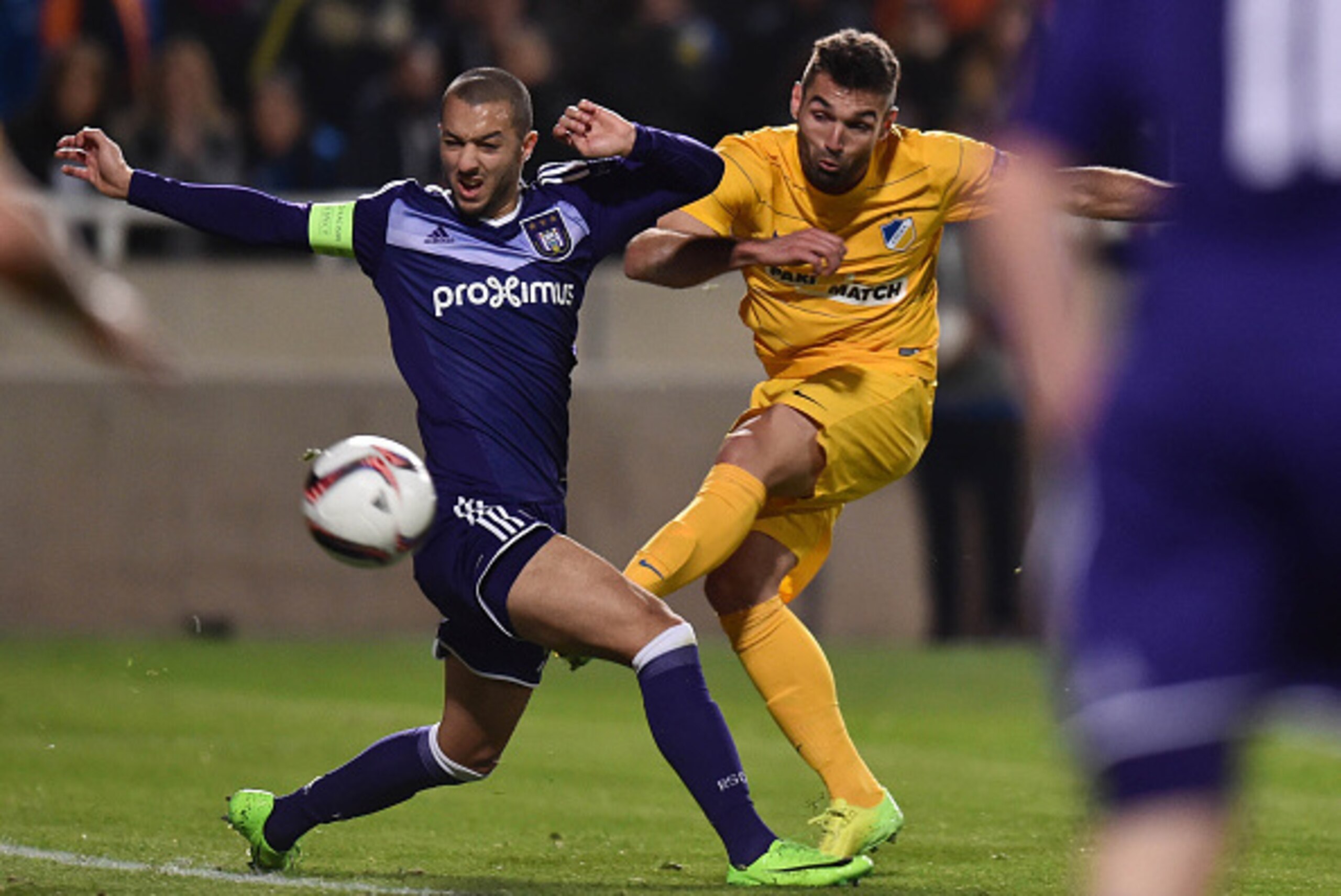 Apoel's Spanish forward David Barral (R)  is tackled by Anderlecht's Algerian midfielder Sofiane Hanni during the Europa League round of 16 football match between APOEL Nicosia vs R.S.C. Anderlecht at the Neo GSP Stadium in Nicosia on March 9, 2017. / AFP