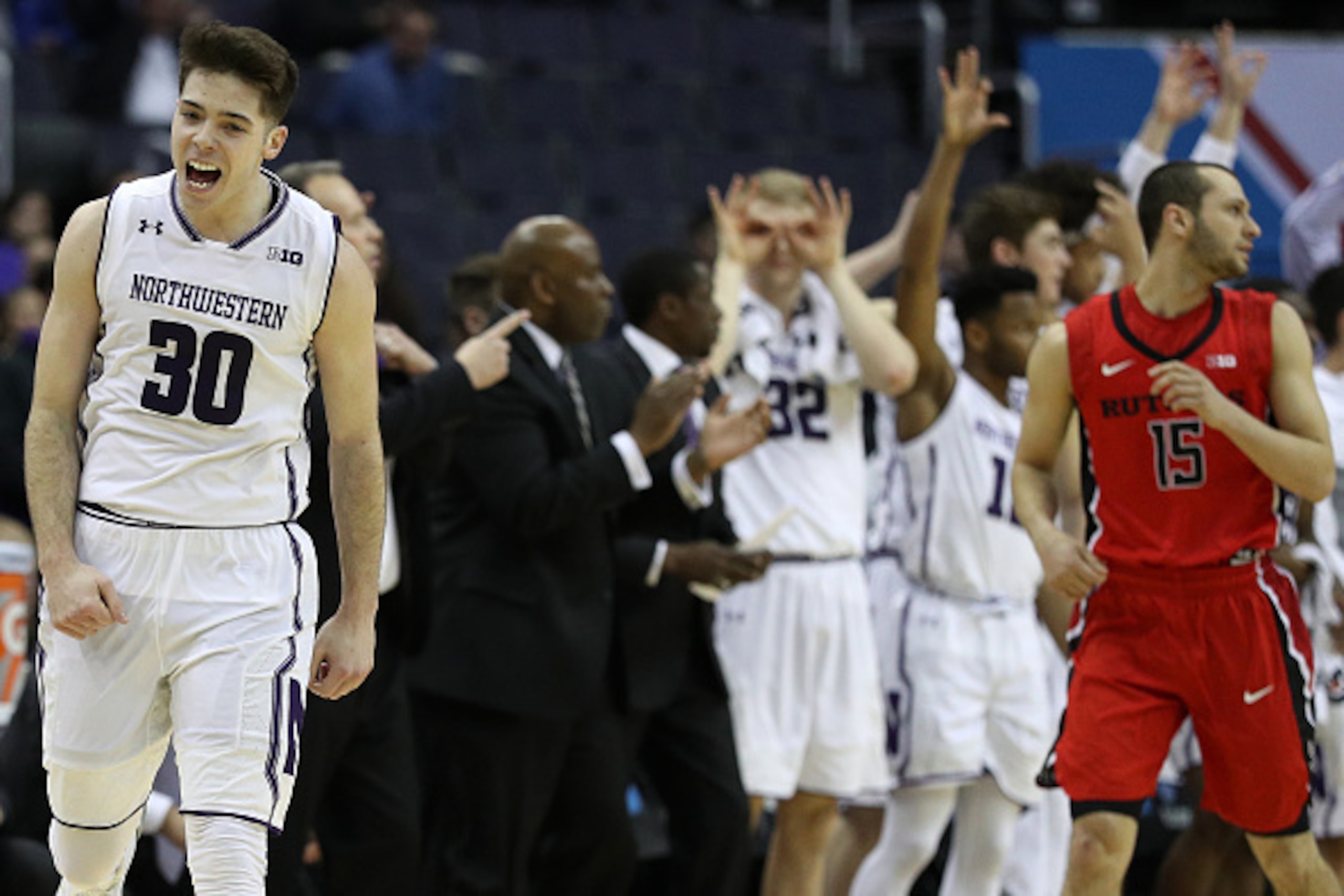 WASHINGTON, DC - MARCH 09: Bryant McIntosh #30 of the Northwestern Wildcats celebrates a basket against the Rutgers Scarlet Knights during the second half in the second round of the Big Ten Basketball Tournament at Verizon Center on March 9, 2017 in Washi