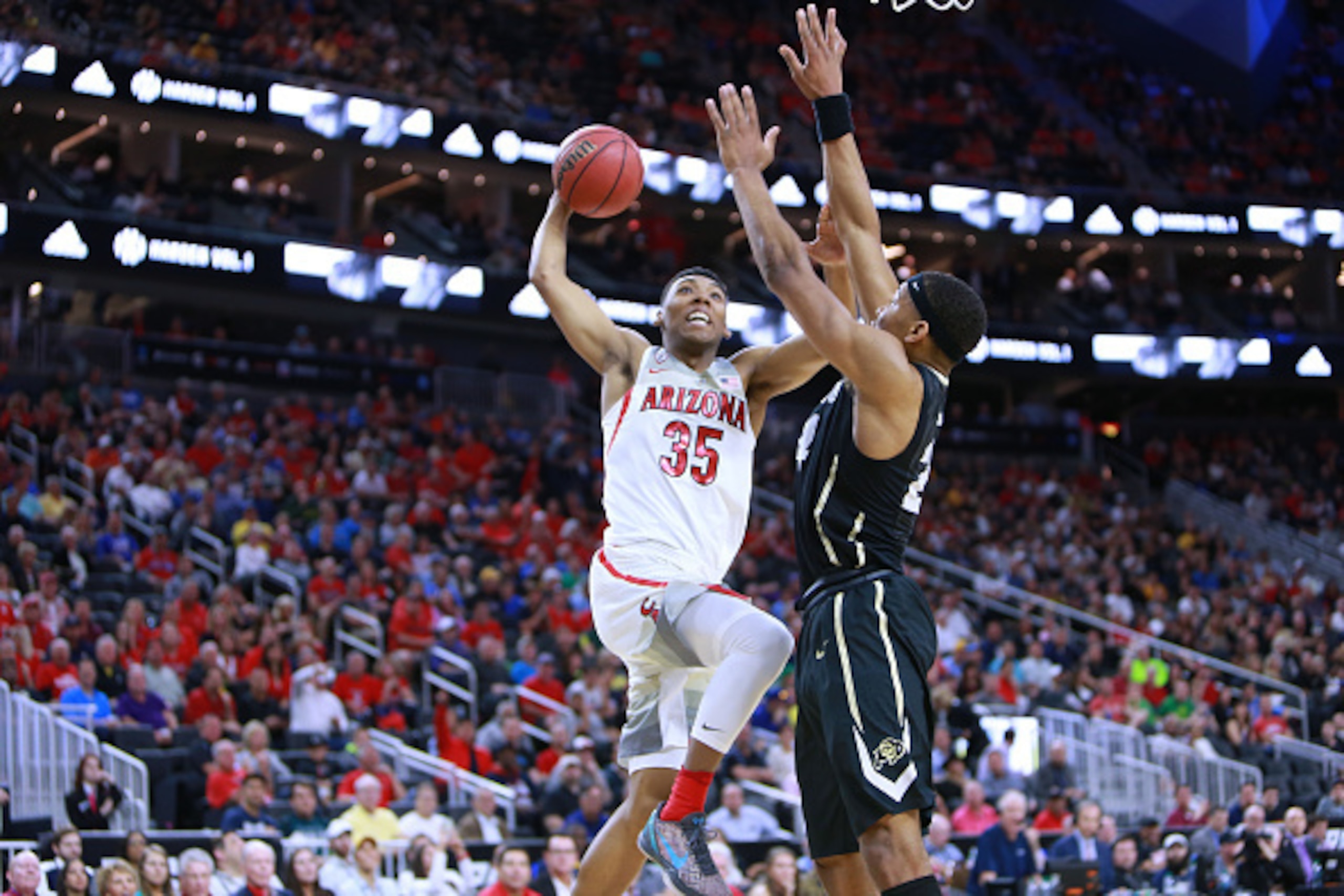 LAS VEGAS, NV - MARCH 09:  Allonzo Trier #35 of the Arizona Wildcats handles the ball against George King #24 of the Colorado Buffaloes during a quarterfinal game of the Pac-12 Basketball Tournament at T-Mobile Arena Arena on March 9, 2017 in Las Vegas, N