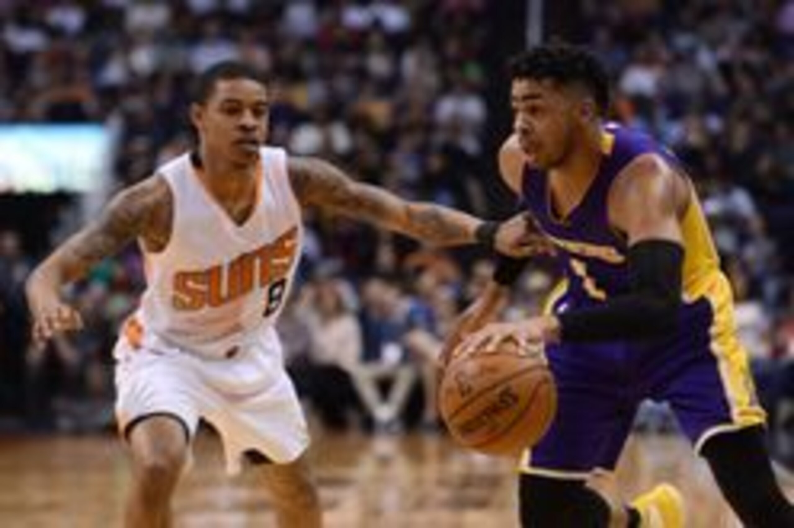 Mar 9, 2017; Phoenix, AZ, USA; Los Angeles Lakers guard D'Angelo Russell (1) dribbles by Phoenix Suns guard Tyler Ulis (8) during the second half at Talking Stick Resort Arena. The Lakers won 122-110. Mandatory Credit: Joe Camporeale-USA TODAY Sports