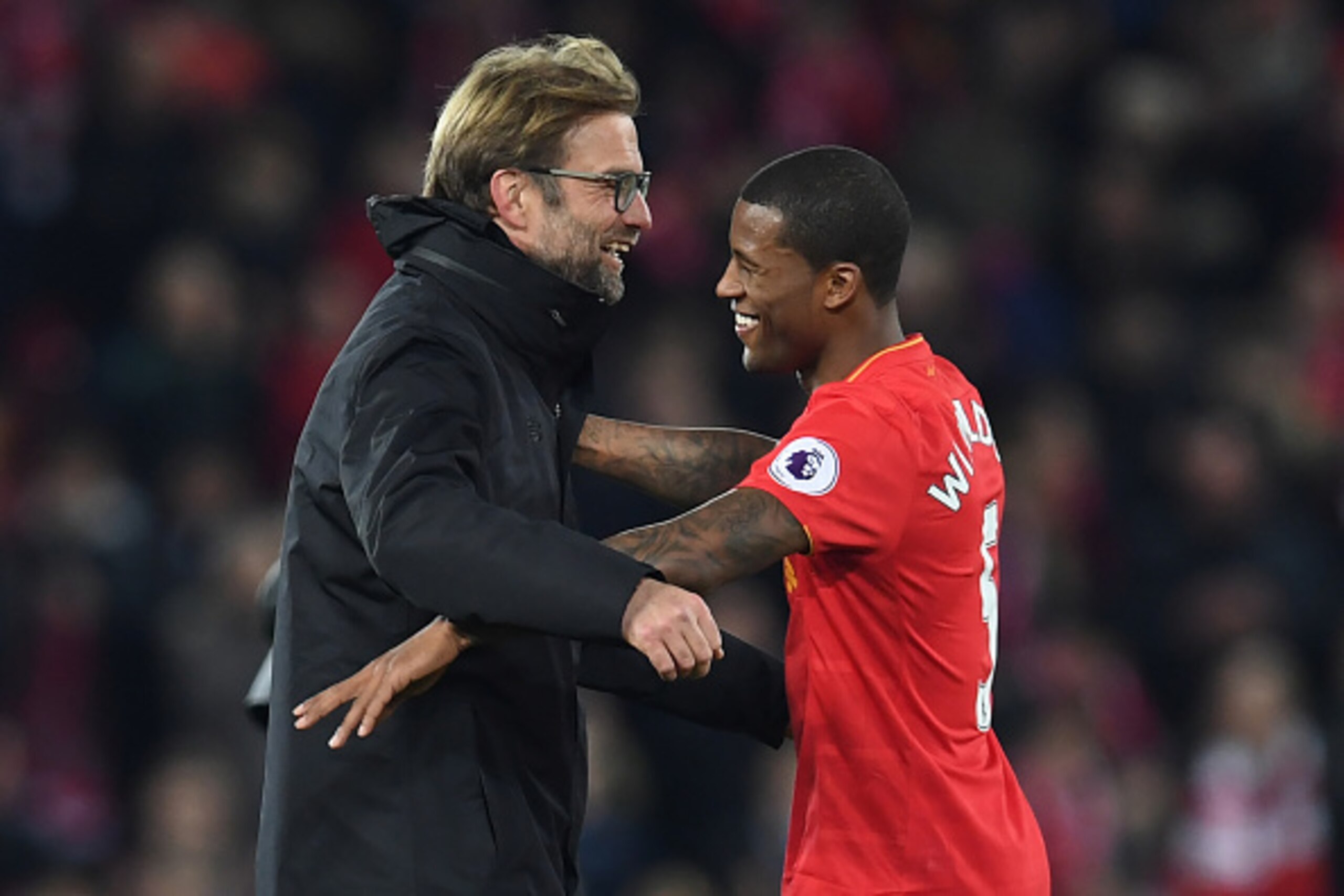 Liverpool's German manager Jurgen Klopp (L) celebrates on the pitch with goalscorer Liverpool's Dutch midfielder Georginio Wijnaldum after the English Premier League football match between Liverpool and Manchester City at Anfield in Liverpool, north west 