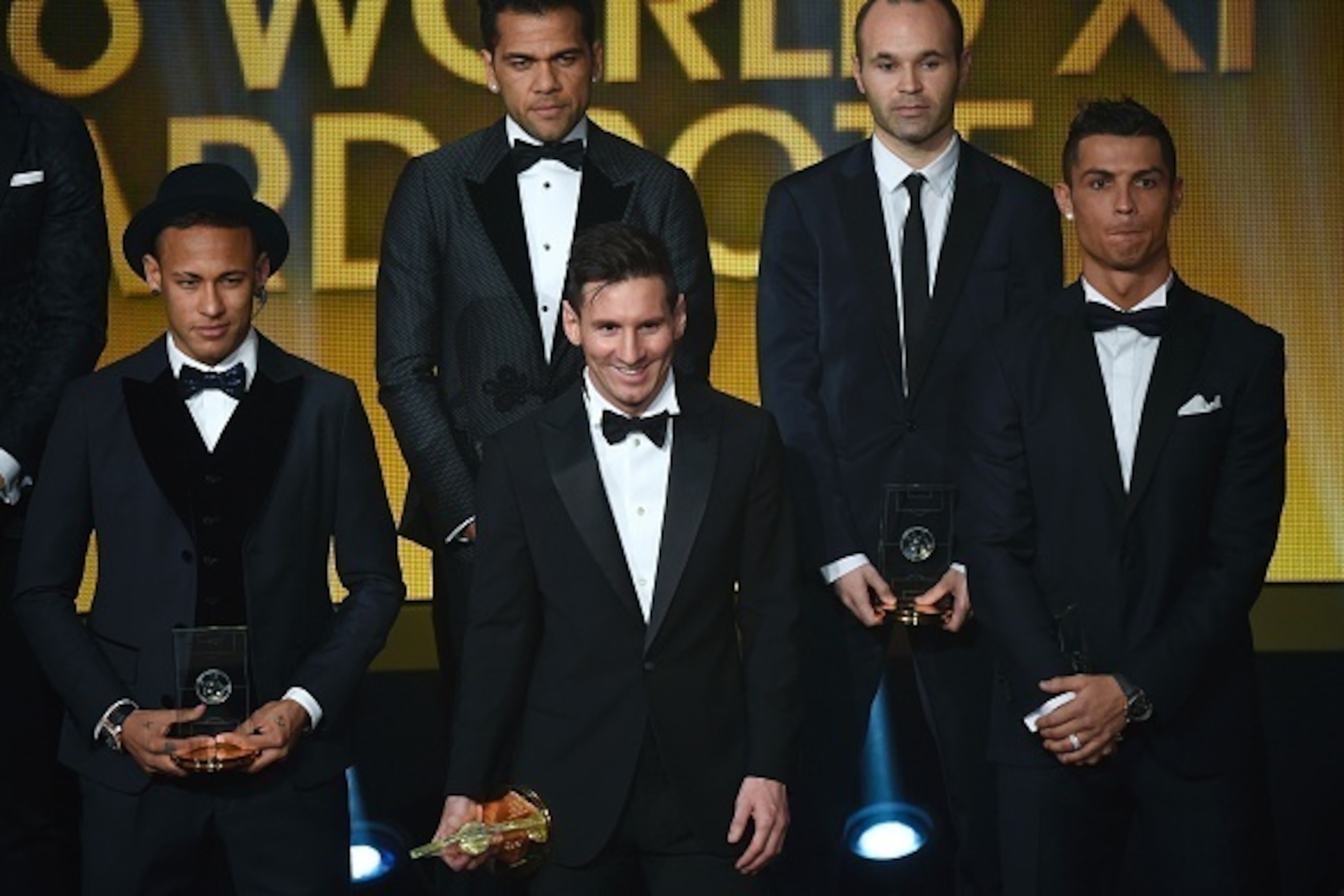 (From L) Brazil and FC Barcelona forward Neymar, Brazil and FC Barcelona defender Dani Alves, Argentina and FC Barcelona forward Lionel Messi, Spain and FC Barcelona midfielder Andres Iniesta and Portugal and Real Madrid forward Cristiano Ronaldo pose on 