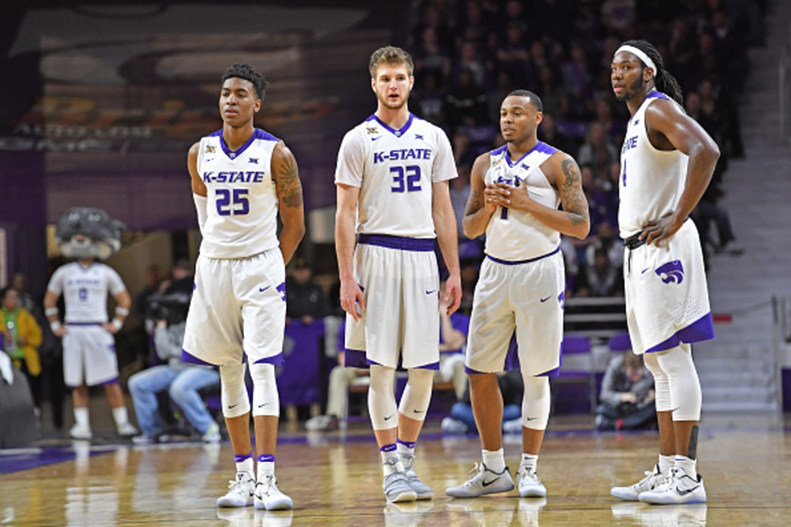 MANHATTAN, KS - FEBRUARY 04:  Players Wesley Iwundu #25, Dean Wade #32, Carlbe Ervin II #1 and D.J. Johnson #4 of the Kansas State Wildcats look on during a stop in the action against the Texas Tech Red Raiders during the second half on March 4, 2017 at B