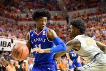 Mar 4, 2017; Stillwater, OK, USA; Kansas Jayhawks guard Josh Jackson (11) fights for position defended by Oklahoma State Cowboys guard Davon Dillard (24) during the first half at Gallagher-Iba Arena. Mandatory Credit: Rob Ferguson-USA TODAY Sports