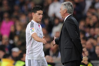 MADRID, SPAIN - DECEMBER 02:  James Rodriguez of Real Madrid shakes hands with his head coach Carlos Ancelotti after being substituted during the Copa Del Rey Round of 32, Second Leg match between Real Madrid CF and Cornella at Santiago Bernabeu stadium o